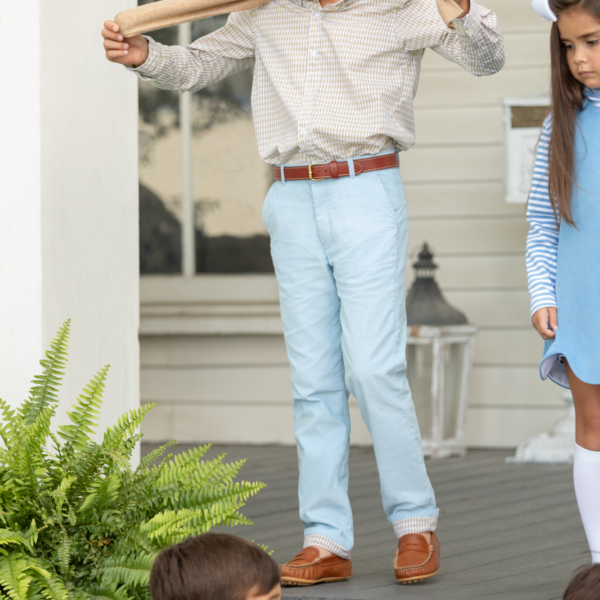 Henry Duvall Bradford Trousers in Bay Tree Blue light blue corduroy for boys, fully lined in King’s Way Khaki Check with contrast checked cuffs that can be rolled up or worn down.