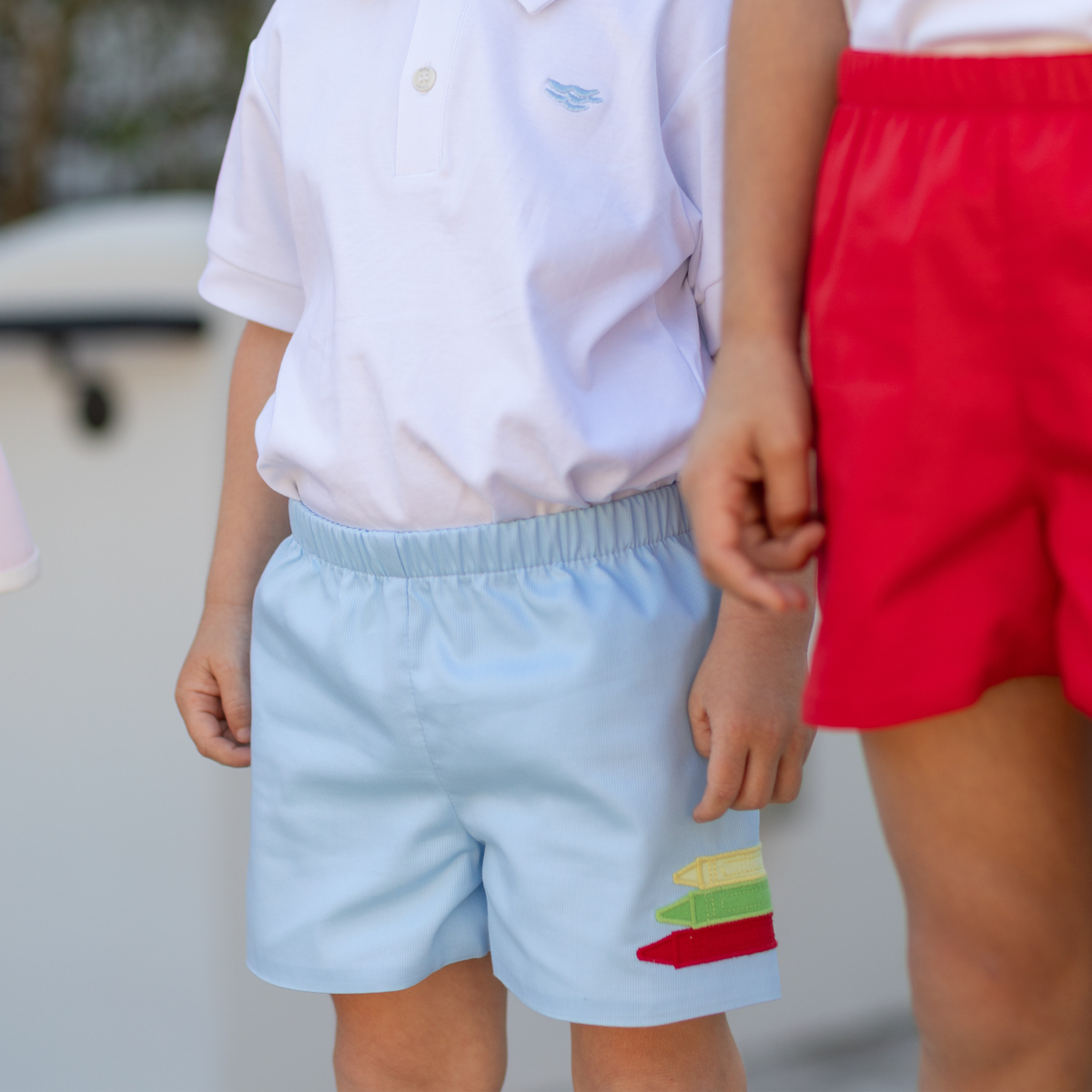 Henry Duvall Liam Shorts in Bailey's Bay Blue with crayon appliqué, classic boys back-to-school shorts with elastic waist for first day of school photos and everyday fall wear.