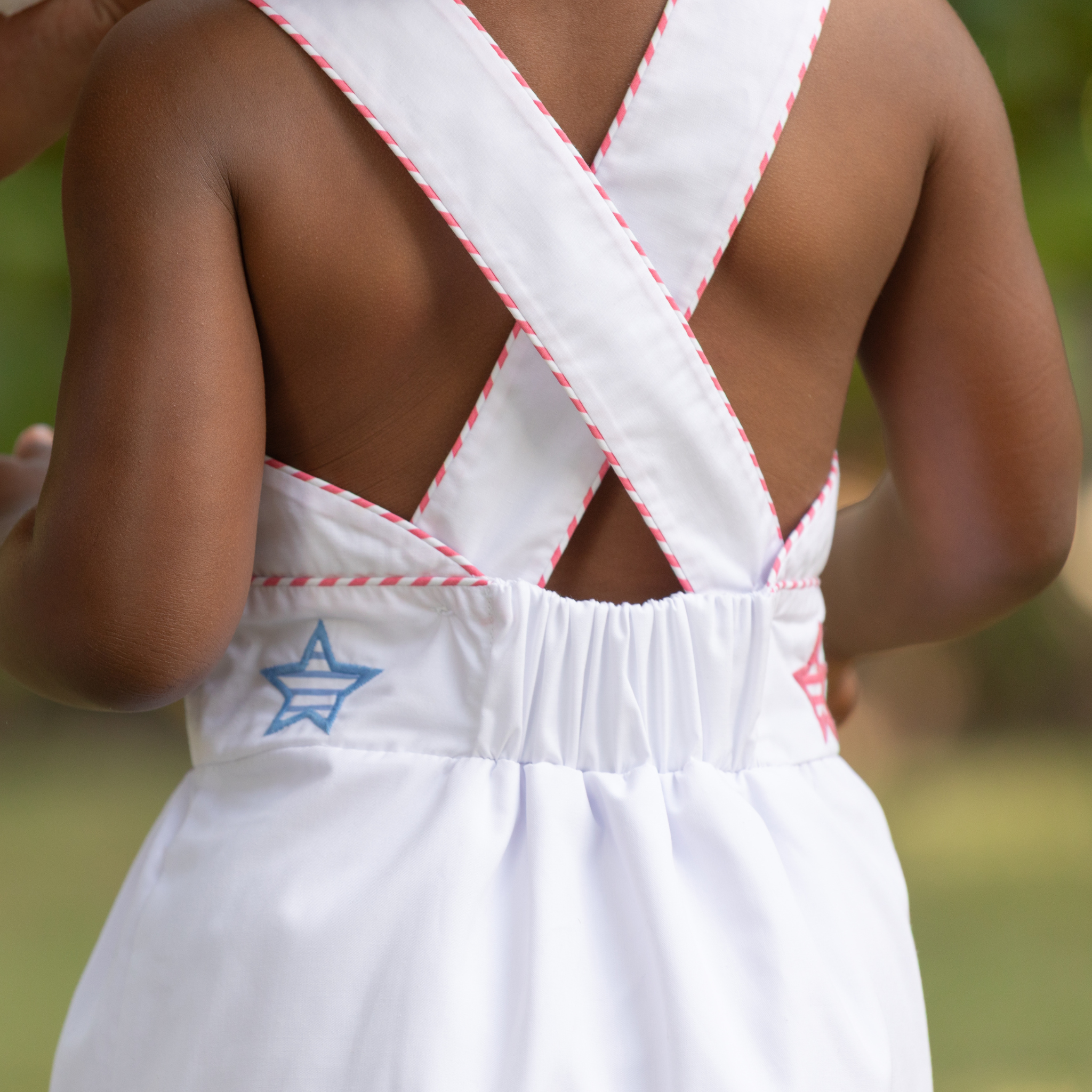 Henry Duvall Campbell girls white dress with red and blue star appliqué and ric rac trim, classic patriotic dress for Memorial Day, 4th of July, and summer occasions