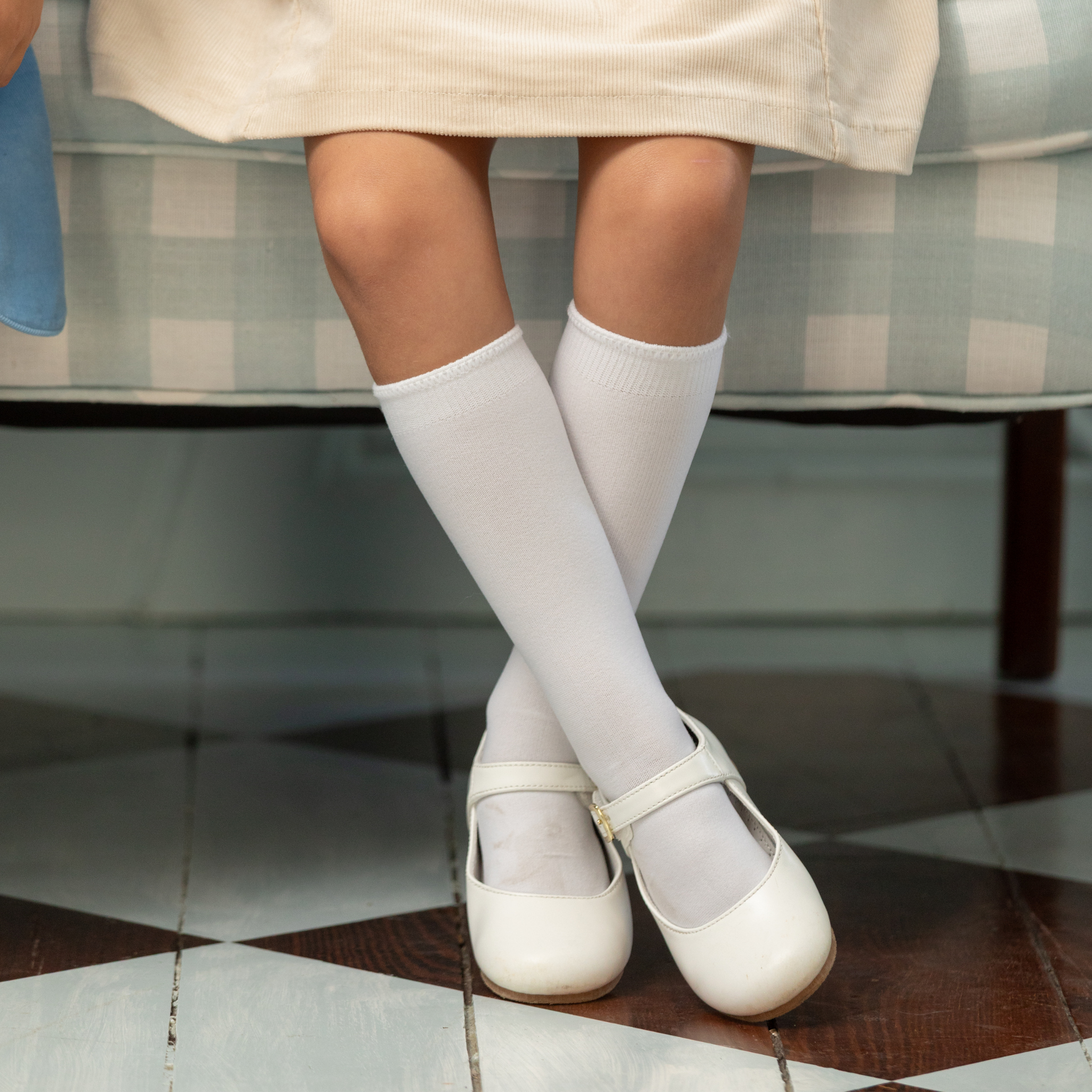 Classic white nylon knee high socks for girls and toddlers, lightweight with ribbed stay-up top, designed for comfort and perfect fit, ideal for pairing with Mary Janes or dress shoes from Henry Duvall’s Fall Collection