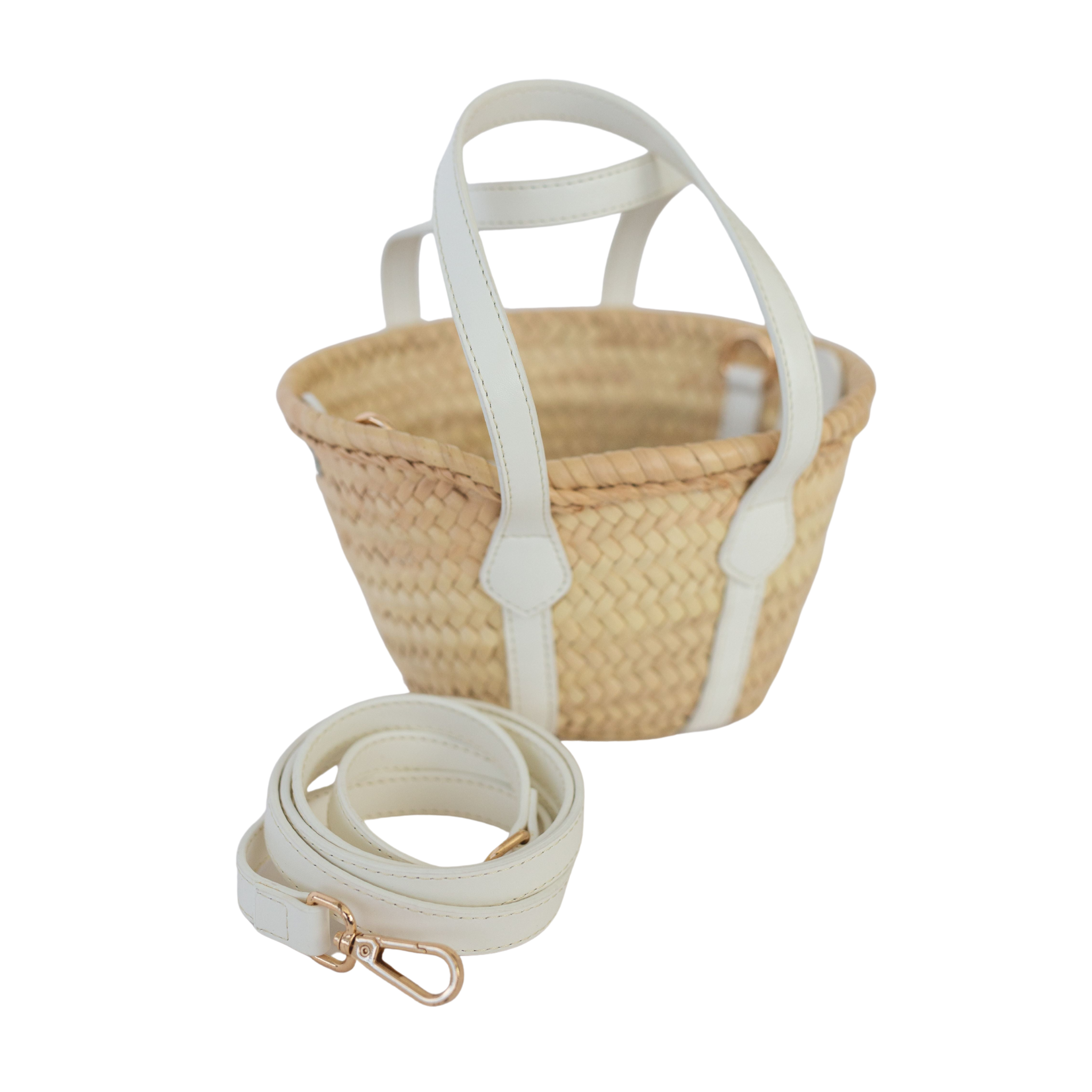 Henry Duvall curated Abby Mini Tote by Breck & Grier, a handwoven mini straw tote with removable pouch and detachable strap.