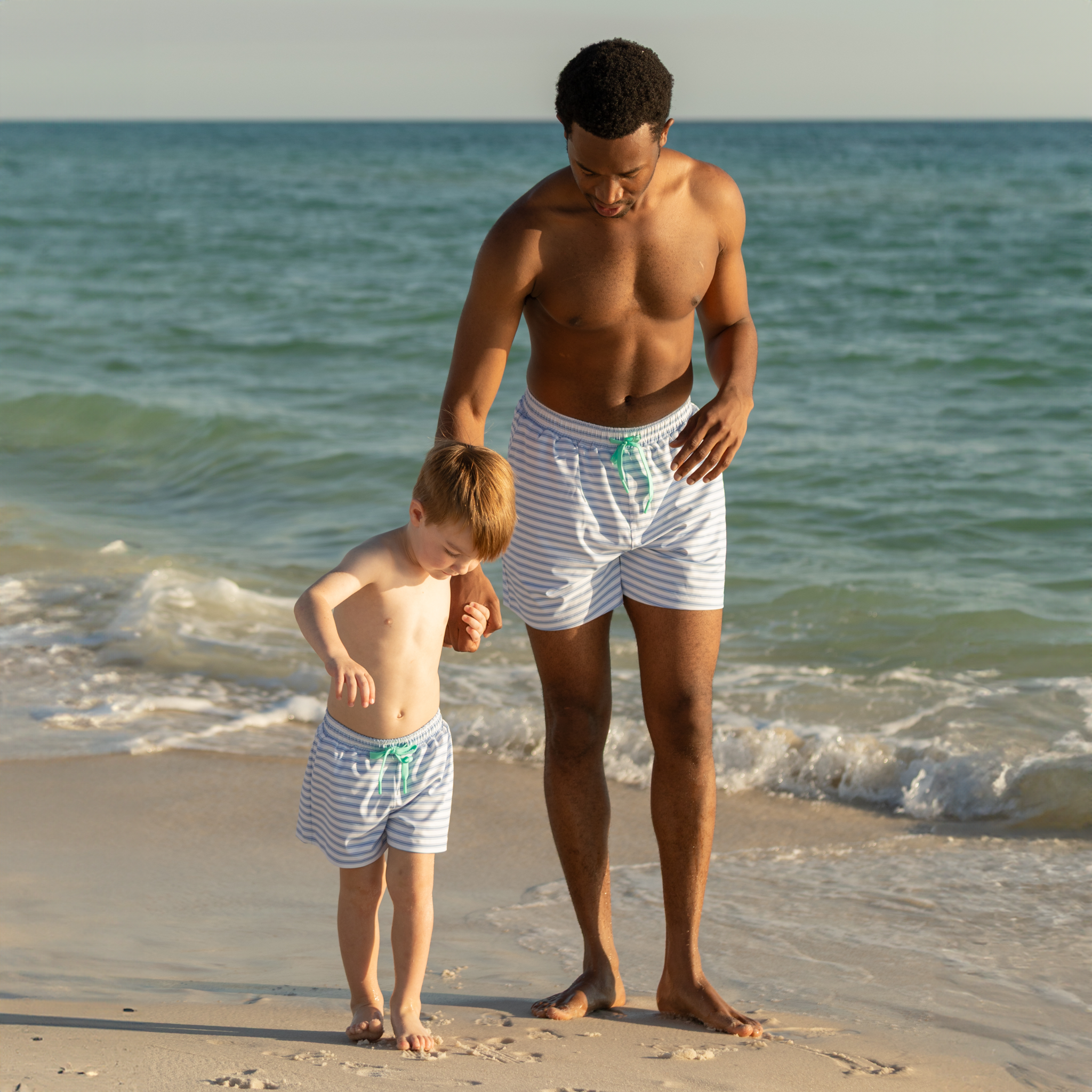 Men’s classic swim trunks by Henry Duvall in matching family prints, featuring UPF 50+ sun protection and an above-the-knee fit.