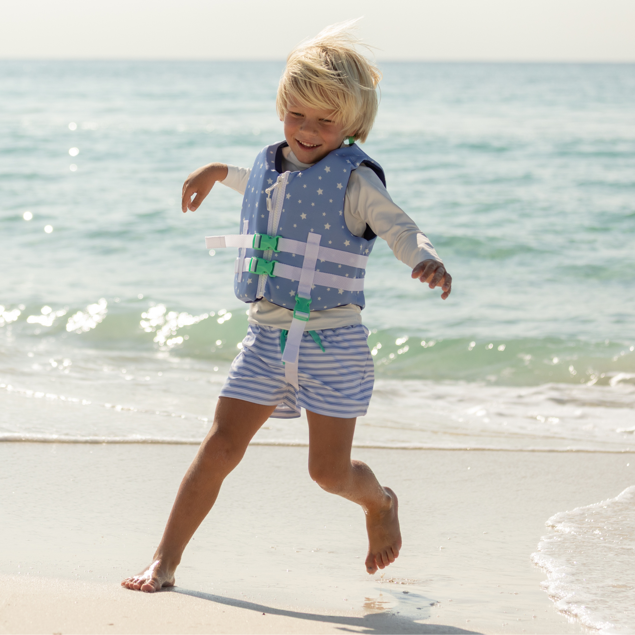 Classic boys’ swim trunks by Henry Duvall in a tailored above-the-knee fit with UPF 50+ protection, featuring an elastic waistband and drawstring for a comfortable summer look.