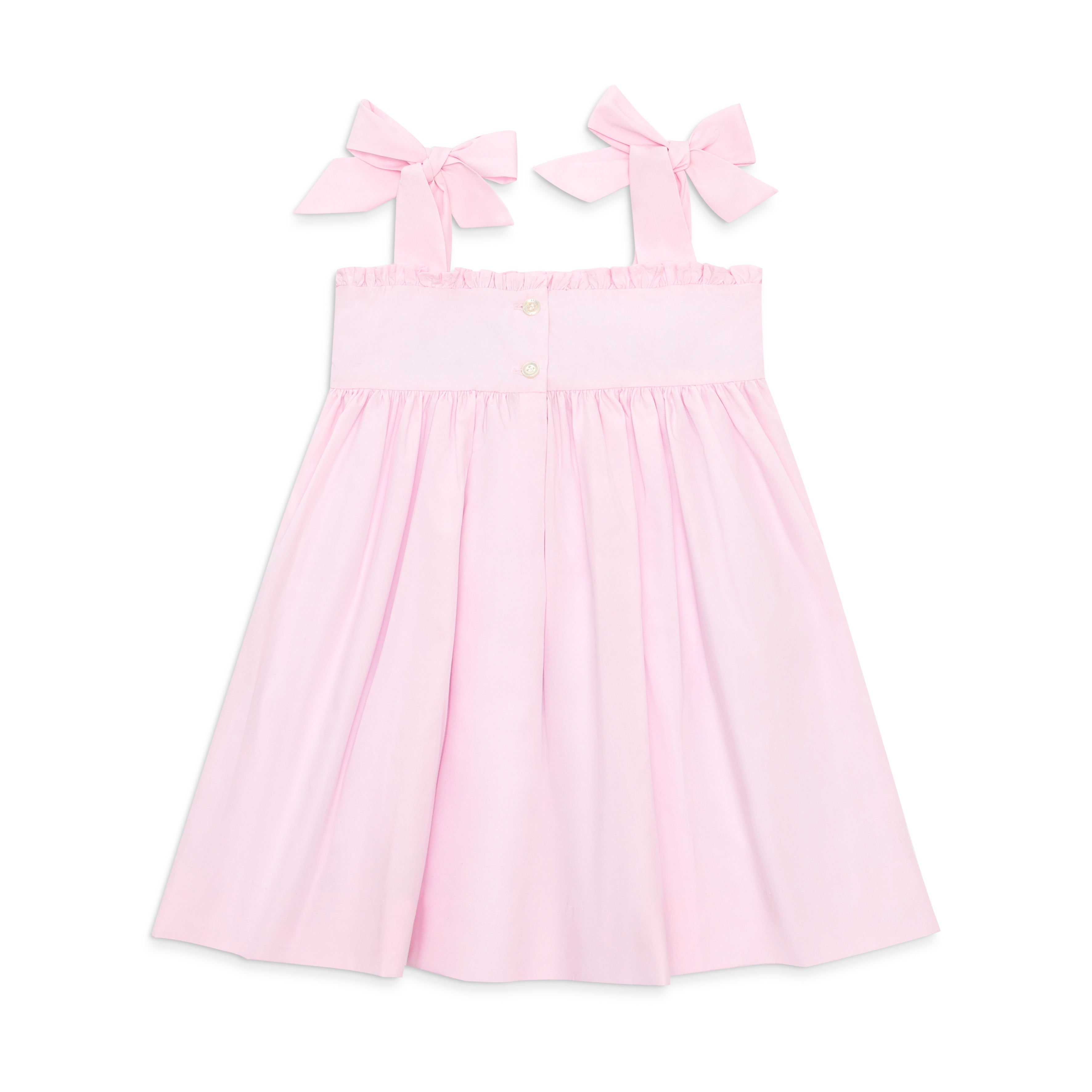 Henry Duvall Daisy Dress in blush pink cotton with hand-smocked crayon embroidery and shoulder bow ties, classic girls back-to-school dress for first day of school photos and fall occasions.
