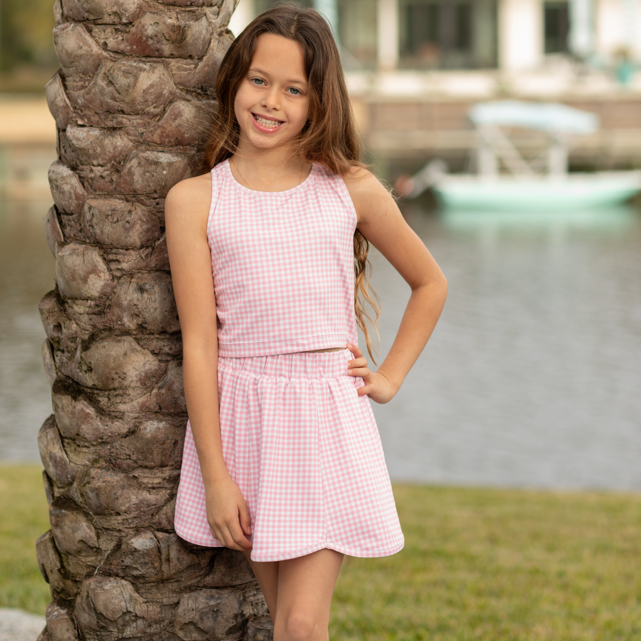 Henry Duvall girls pink gingham athleisure set with scalloped skort and matching sleeveless top, classic preppy active outfit for summer and tennis.