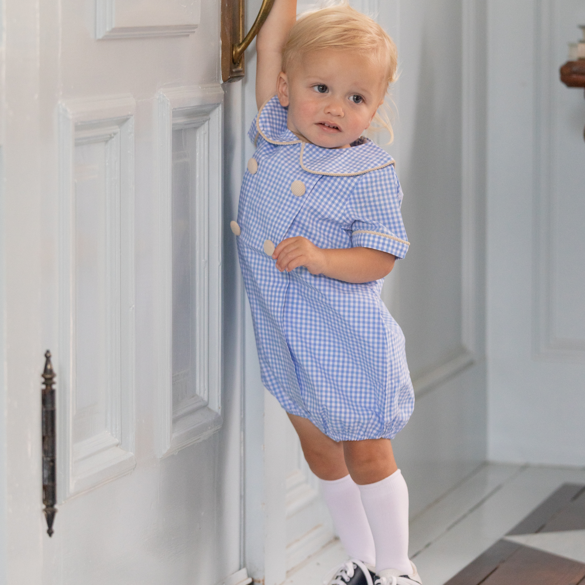 Henry Duvall Banks Bubble in classic blue Charles Street Check with King’s Way Khaki Corduroy trim, classic fall baby boy outfit with covered buttons and diaper snaps
