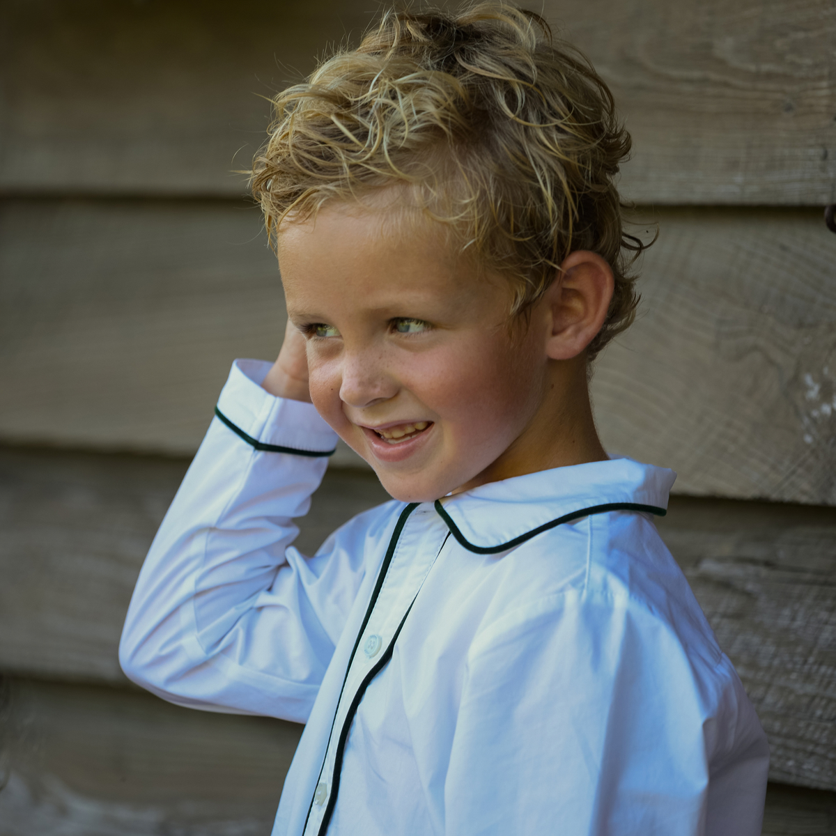 Sullivan Shorts Set for boys in Grafton Green Velvet, featuring a white long-sleeve Peter Pan collar shirt with green piping and coordinating green velvet shorts.