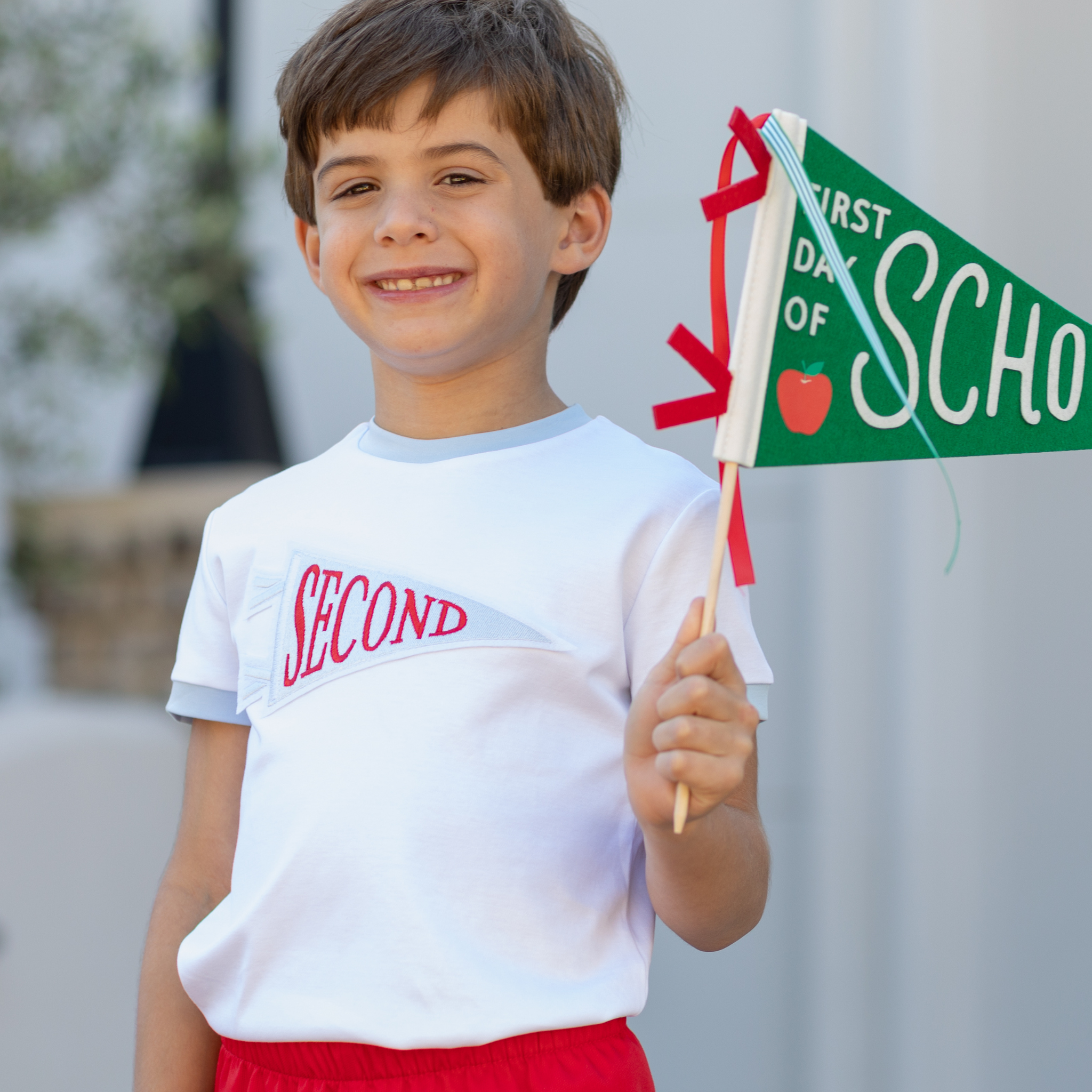 Henry Duvall Pennant Tee featuring appliqué grade pennant, classic back-to-school shirt for kindergarten through fifth grade, perfect for first day of school photos and school milestone celebrations.