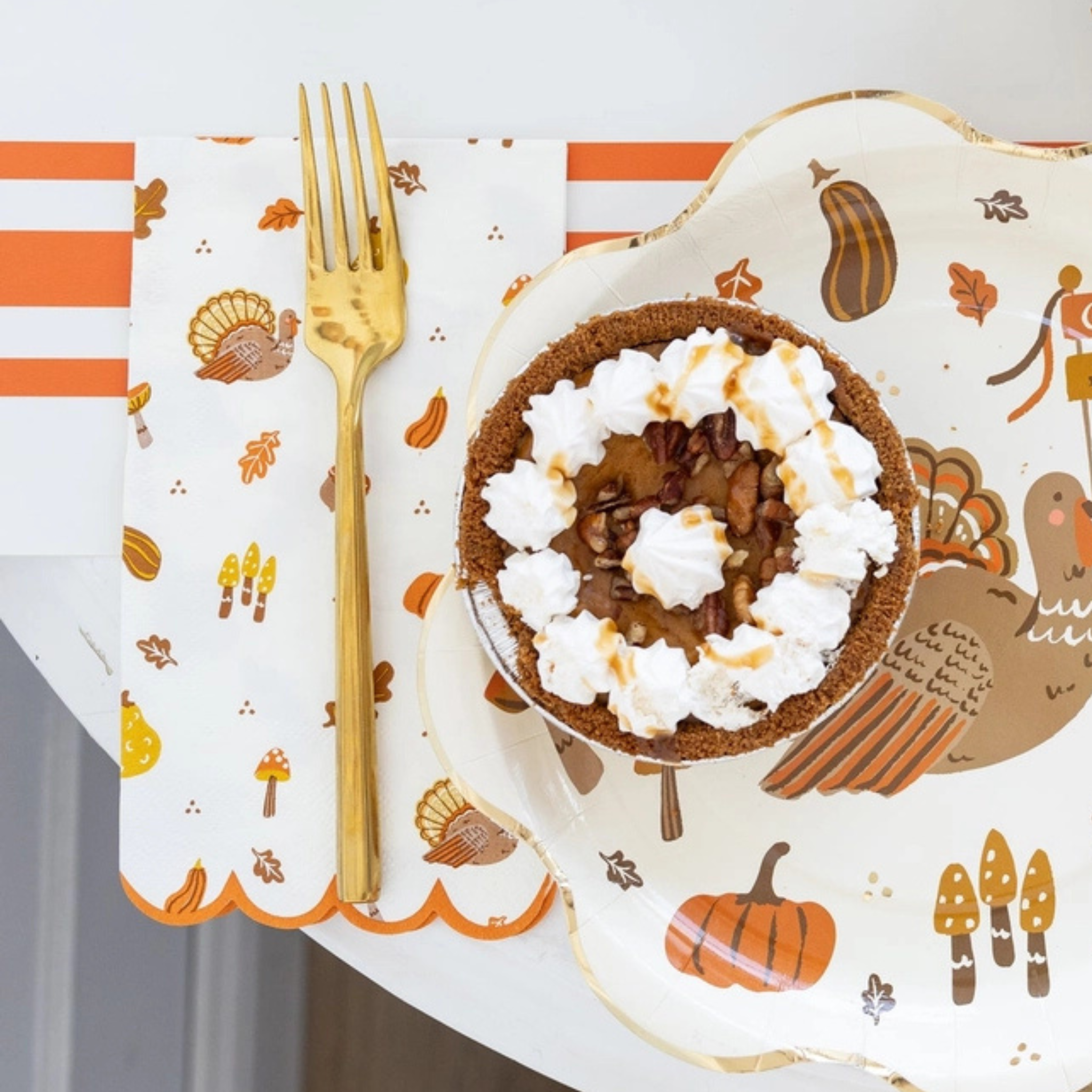 Thanksgiving dinner napkins with festive icons including pumpkins, leaves, and turkeys, set of 24 paper napkins for fall and holiday entertaining