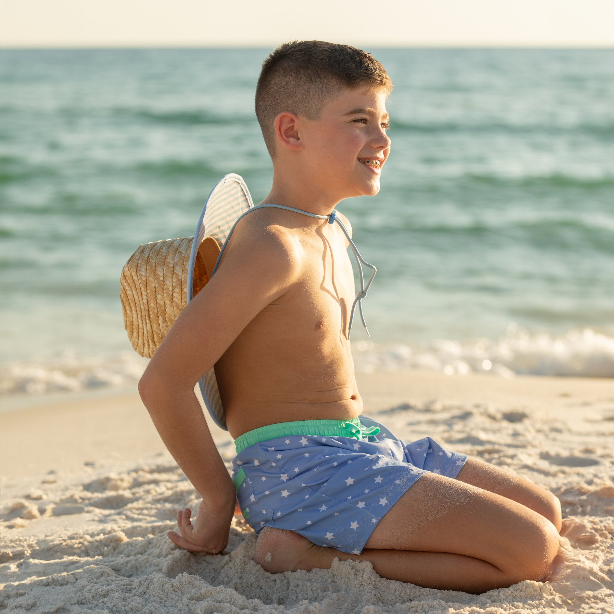 Classic boys’ swim trunks by Henry Duvall in a tailored above-the-knee fit with UPF 50+ protection, featuring an elastic waistband and drawstring for a comfortable summer look.