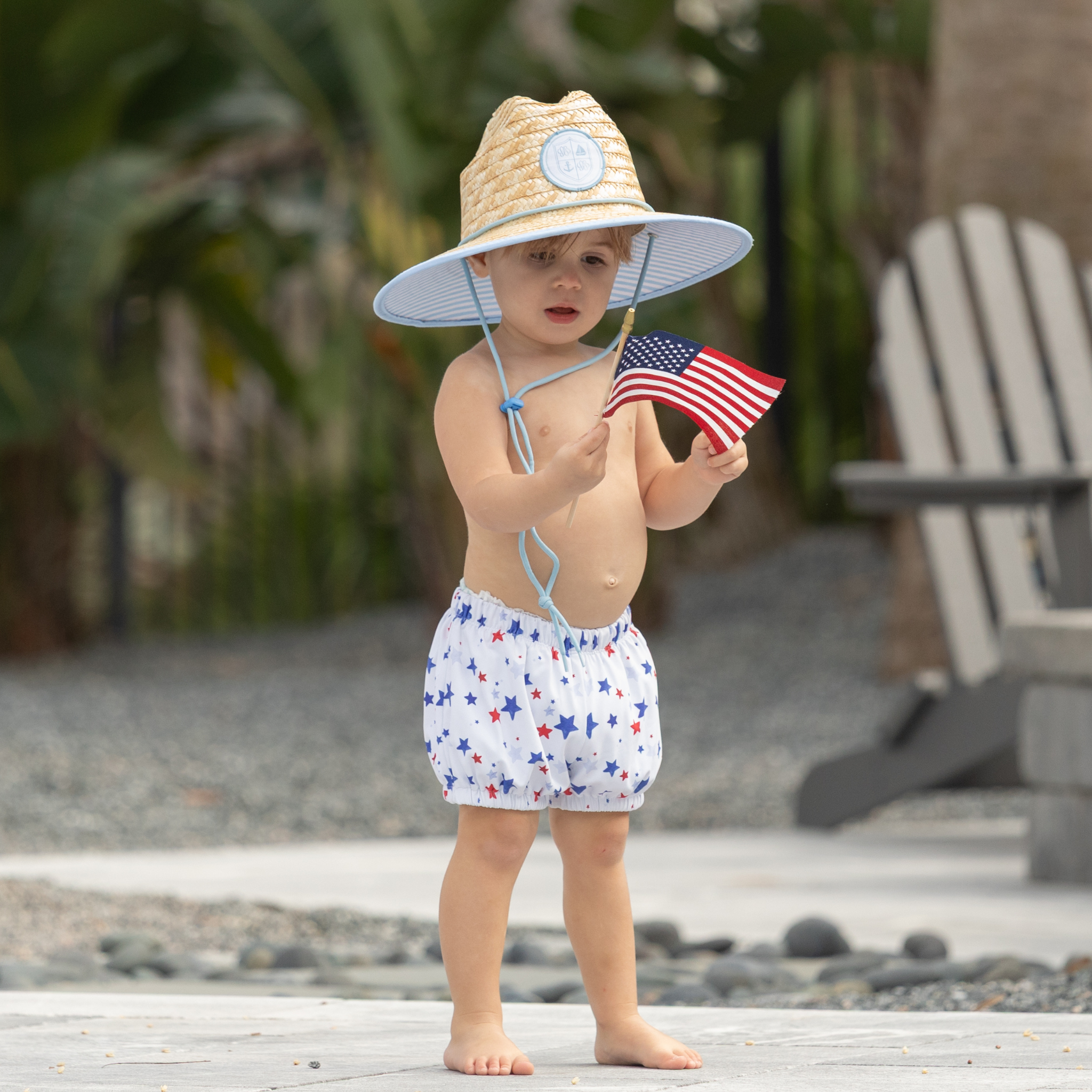Henry Duvall baby swim shorties in red white and blue star print, patriotic UPF 50+ baby swim bloomers for Memorial Day, 4th of July, beach vacations, and summer wear