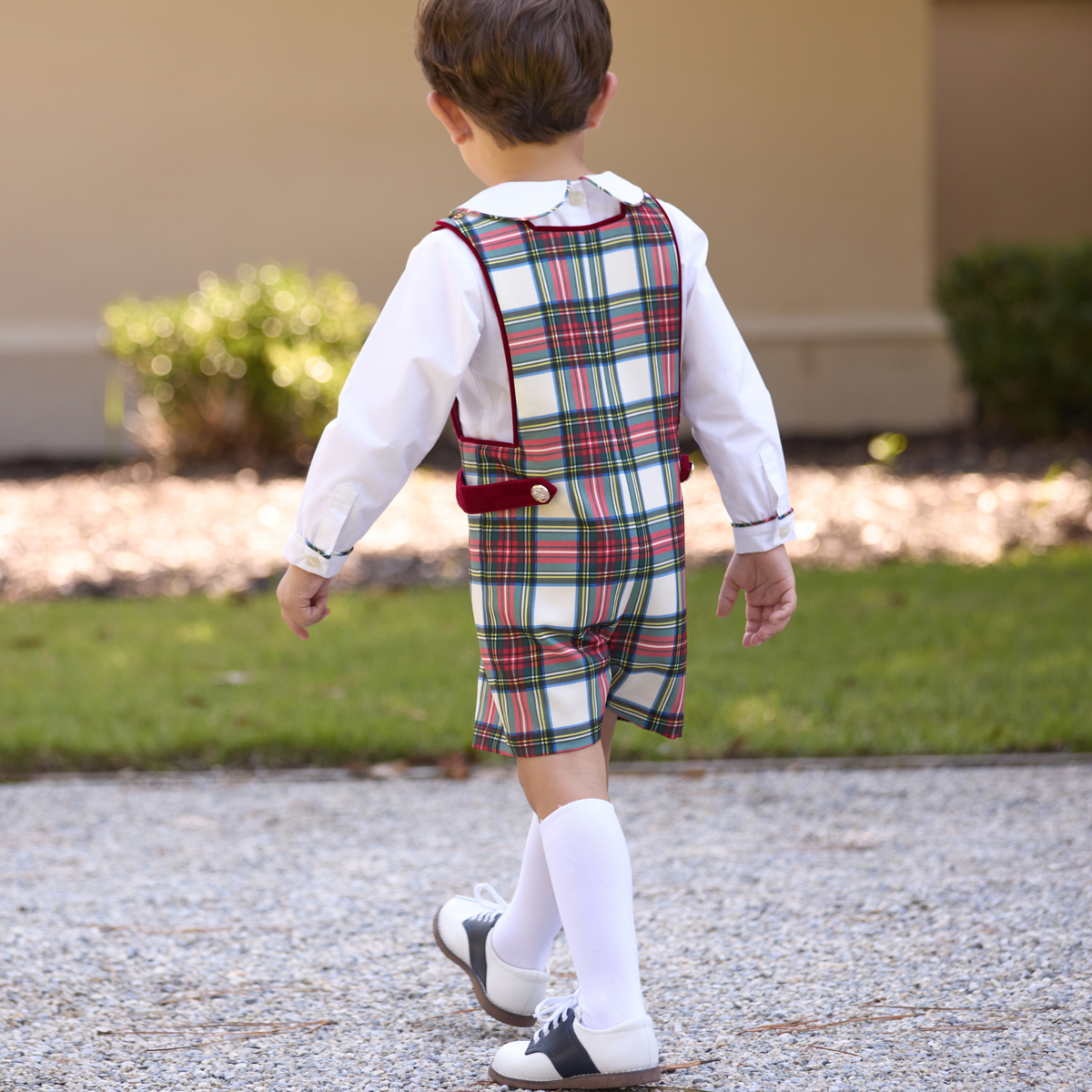 James Henry Jon Jon in Townsend Tartan, a red and green plaid holiday outfit for baby and toddler boys with red velvet trim and gold buttons.