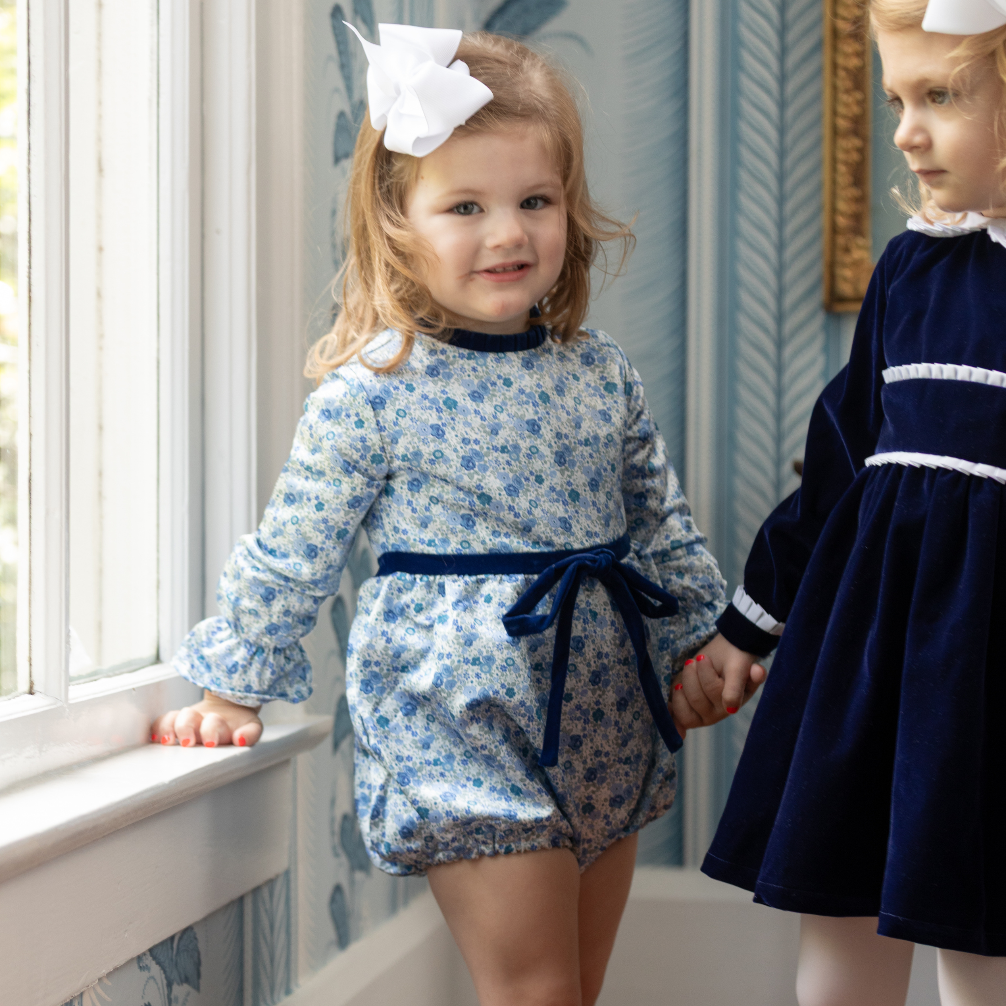 Henry Duvall Hazel Bubble in Prescott Petals floral with Back Bay Blue Velvet bow, classic baby girl fall romper designed to coordinate with sibling and mommy styles