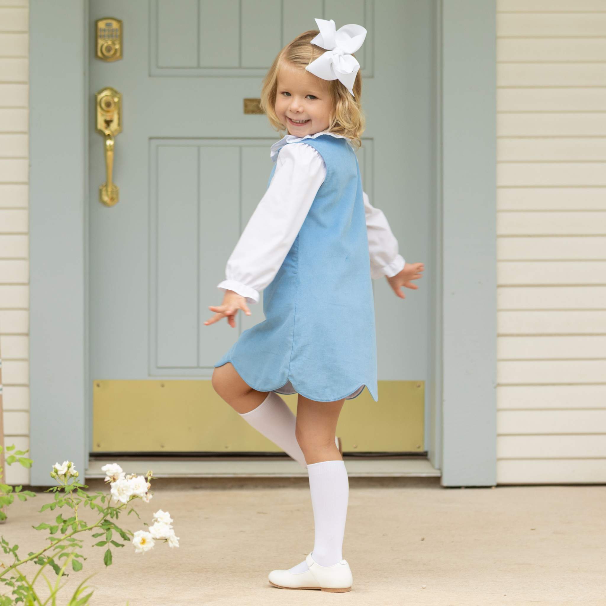 Henry Duvall Ruthie Ruffled Blouse for girls in Classic White, featuring a ruffle collar, long sleeves, and ruffled cuffs for fall and winter layering.