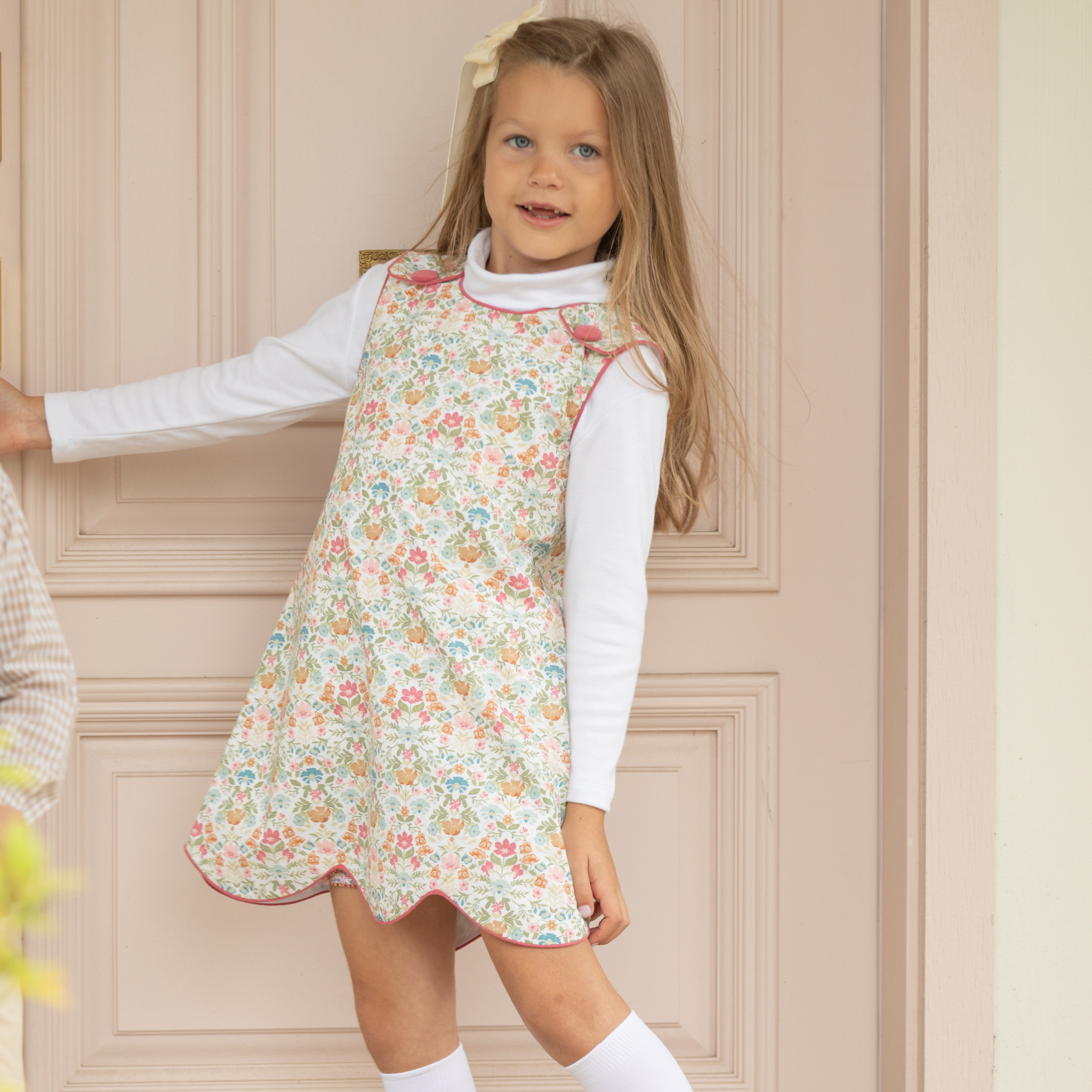 Henry Duvall Janie Jumper girls’ dress in Fall Floral with scalloped hem and fabric-covered shoulder buttons, designed for layering with blouses and turtlenecks for fall.