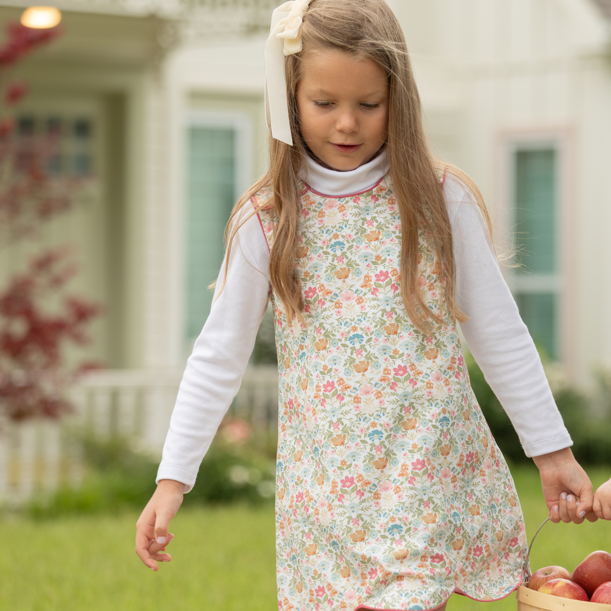 Henry Duvall Janie Jumper girls’ dress in Fall Floral with scalloped hem and fabric-covered shoulder buttons, designed for layering with blouses and turtlenecks for fall.