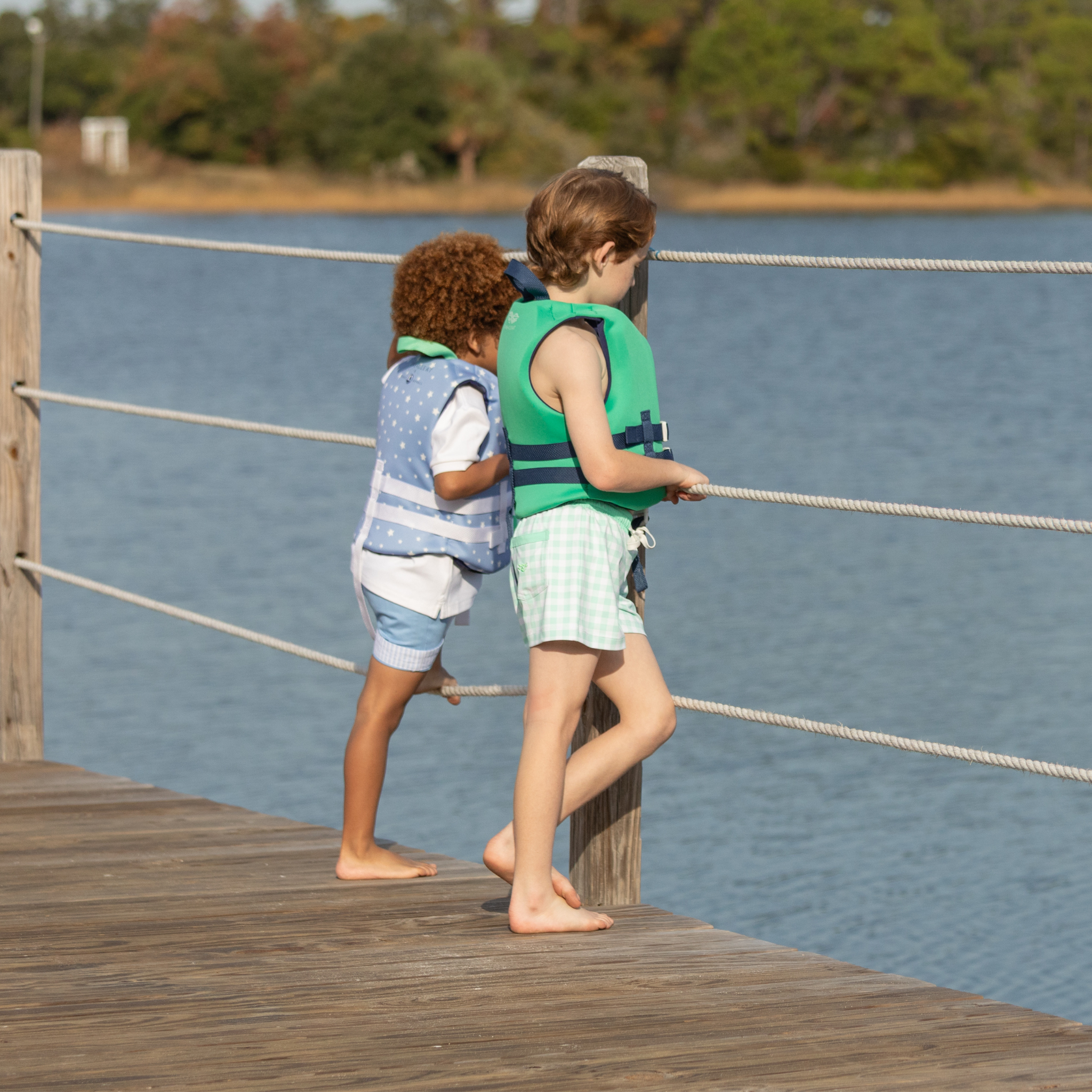 Classic boys’ swim trunks by Henry Duvall in a tailored above-the-knee fit with UPF 50+ protection, featuring an elastic waistband and drawstring for a comfortable summer look.