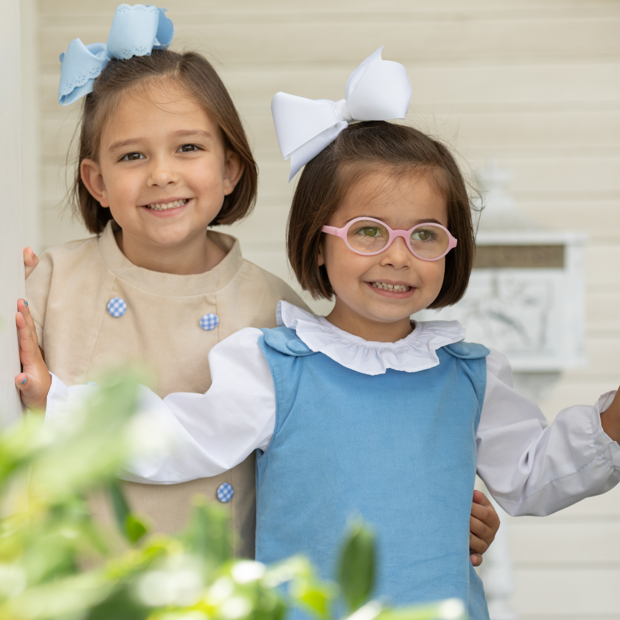 Henry Duvall Janie Jumper girls’ dress in Brookhaven Blue corduroy with scalloped hem and fabric-covered shoulder buttons, designed for layering with blouses and turtlenecks for fall.