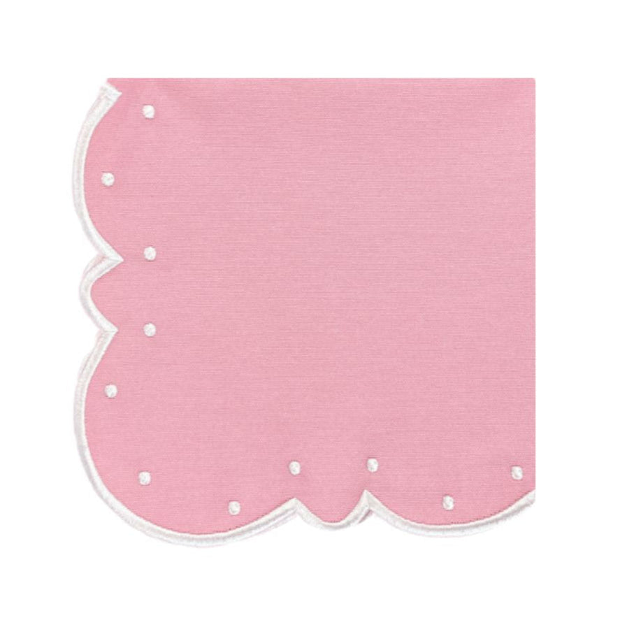 Pink scalloped edge napkin on a white background
