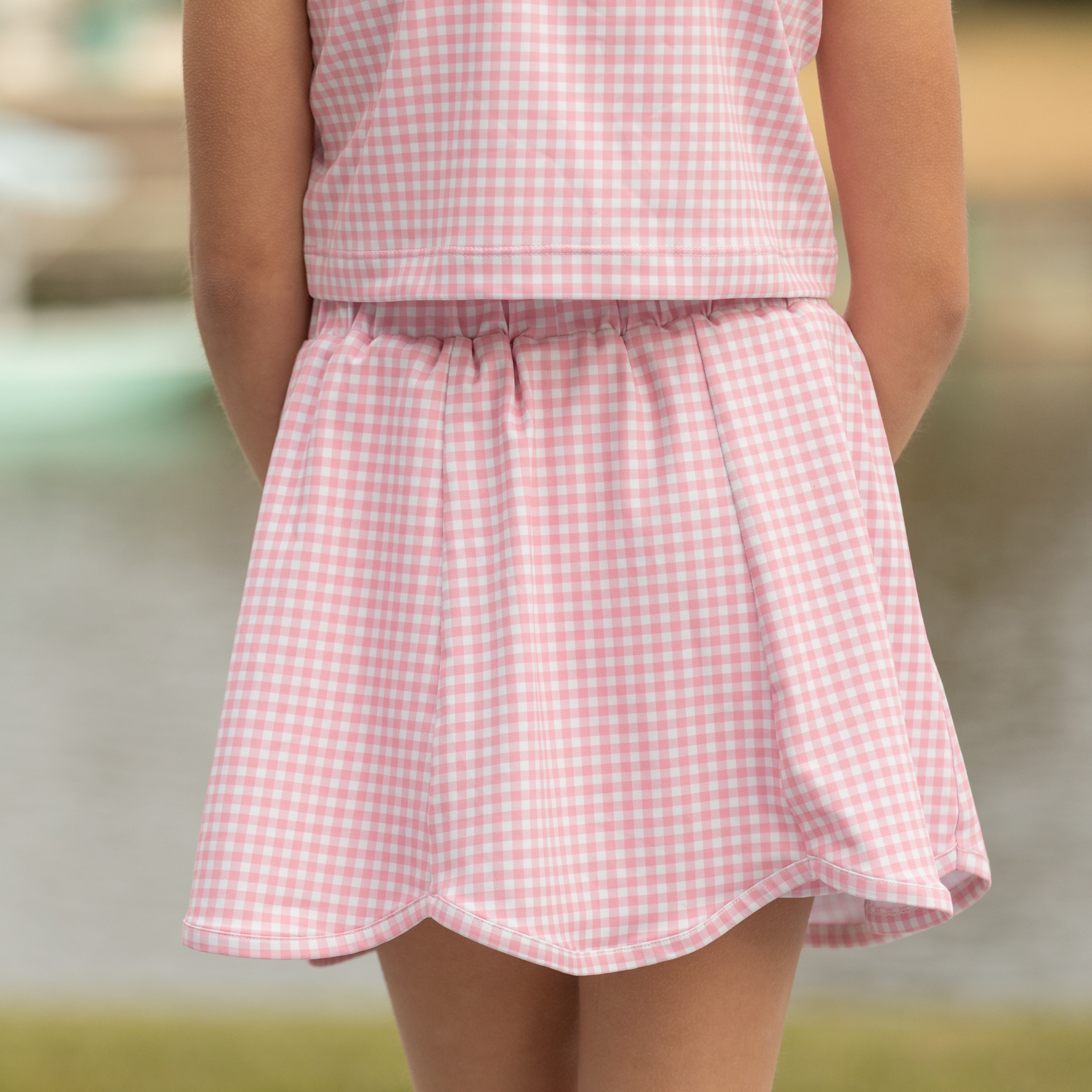 Henry Duvall girls pink gingham athleisure set with scalloped skort and matching sleeveless top, classic preppy active outfit for summer and tennis.