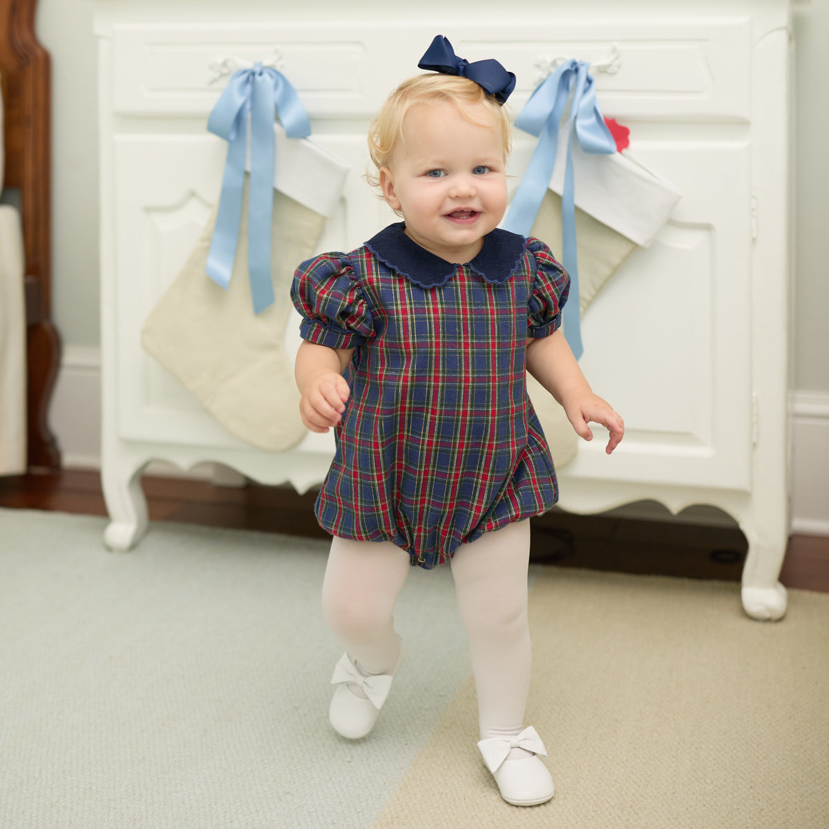 Girls’ Beatrice Bubble in navy, red, and green Tinsel Tartan with subtle metallic thread, Midnight Blue Corduroy scalloped collar, and scalloped sleeve trim.
