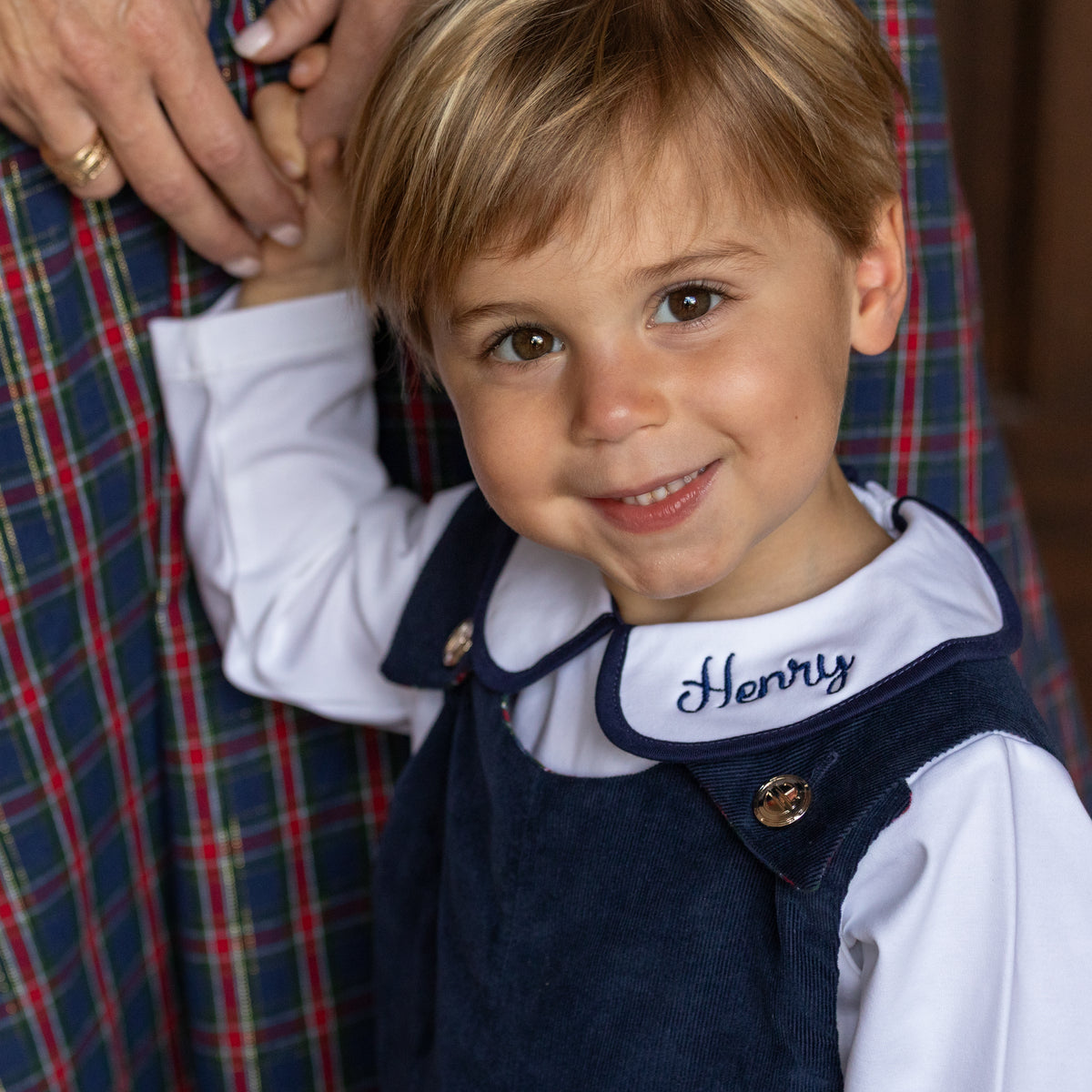 Boys’ Louis Longall in Midnight Blue Corduroy with Tinsel Tartan tabs, HD gold buttons, and full tartan lining designed to show when the cuffs are rolled.
