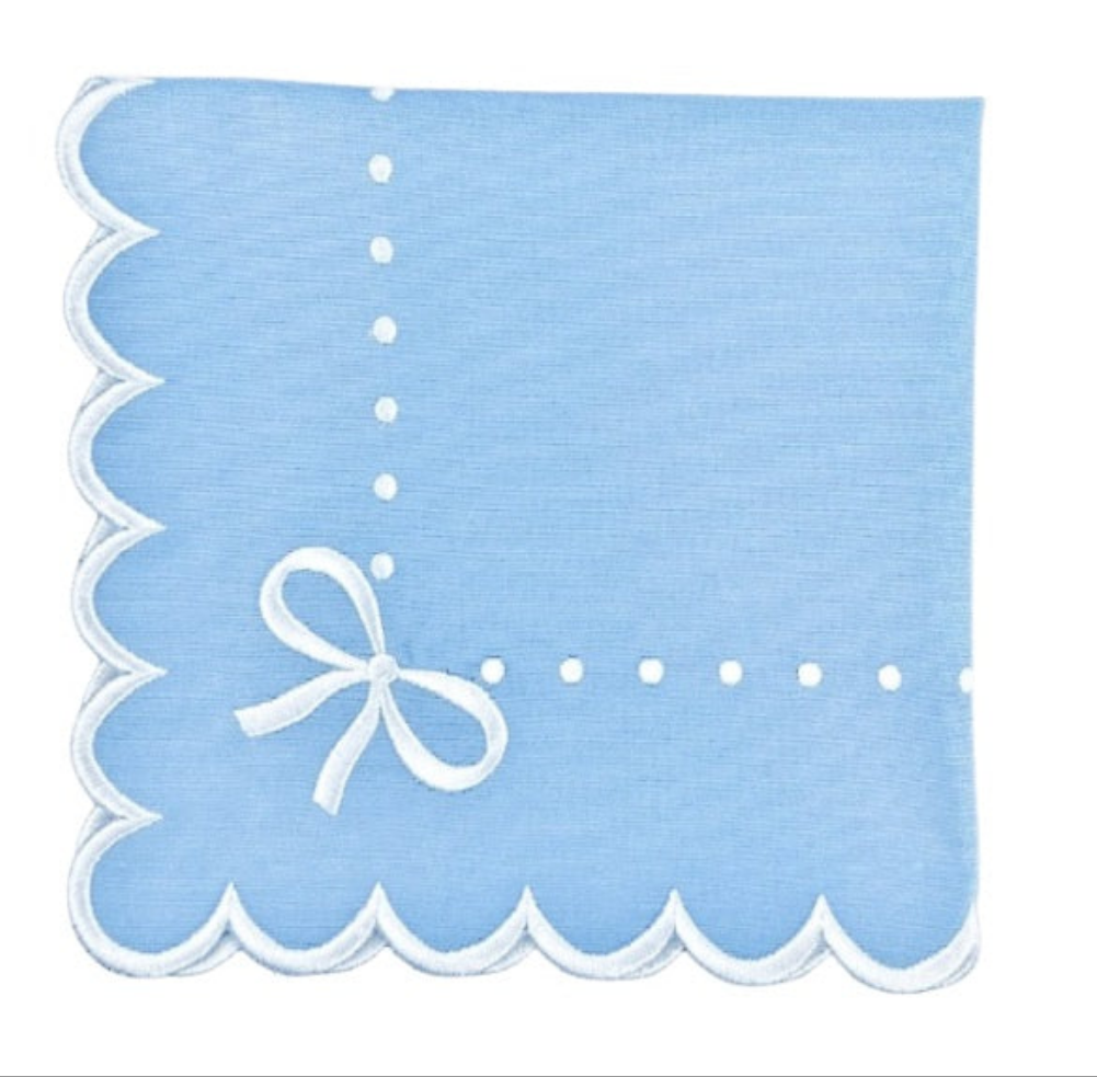 Light blue fabric with white scalloped edge and bow design on a white background