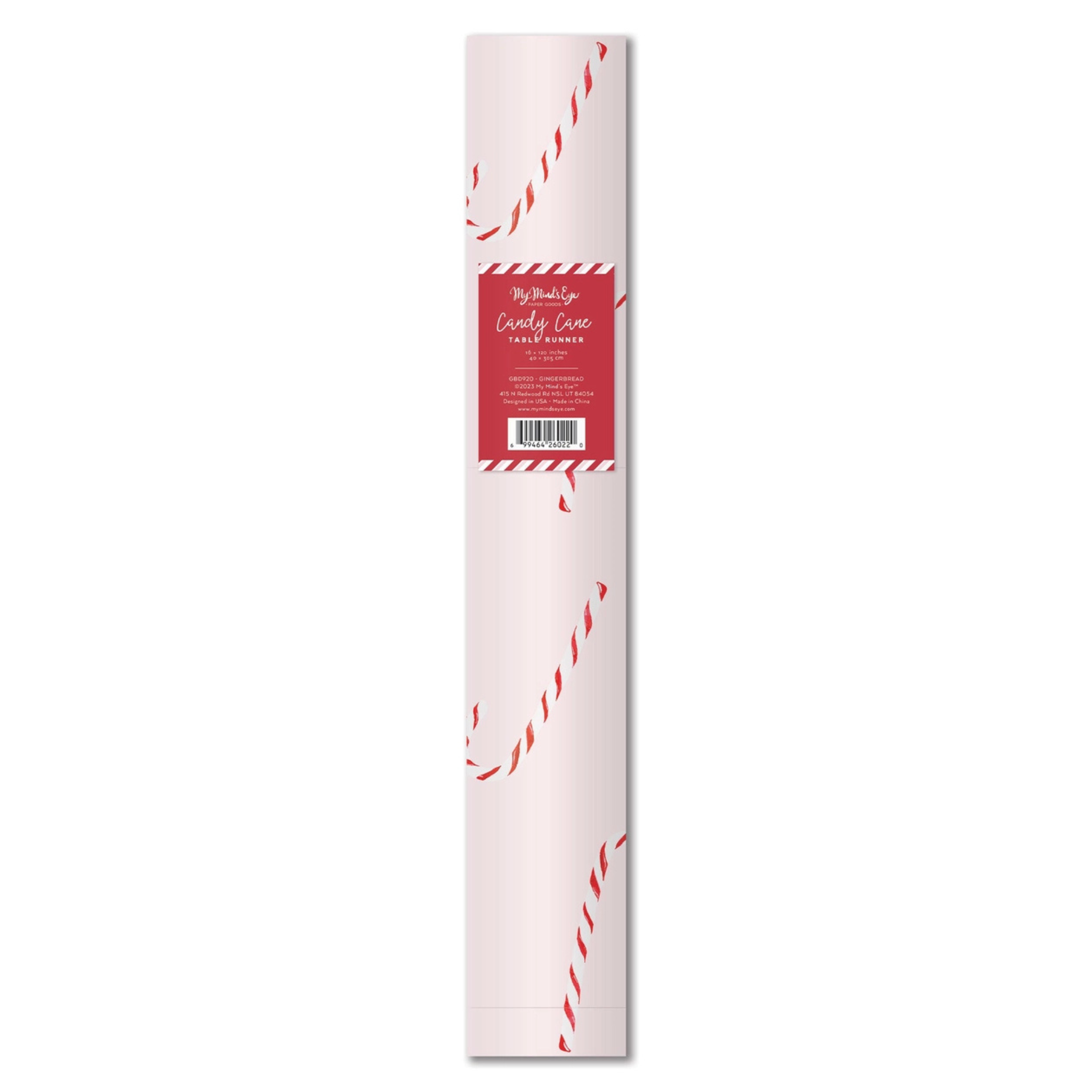 Blush pink Christmas table runner with red candy cane pattern, perfect for whimsical and festive holiday table settings