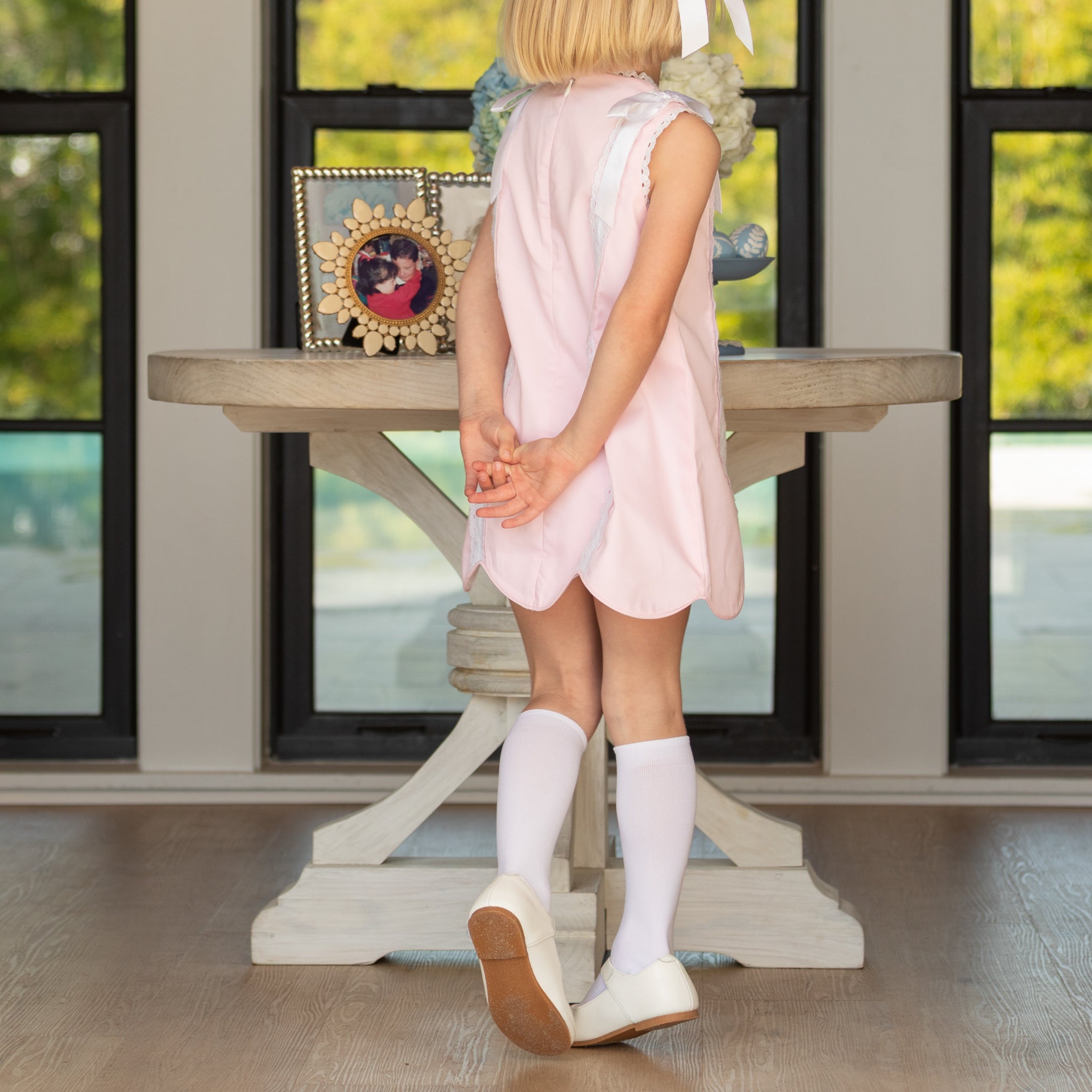 Classic white nylon knee high socks for girls and toddlers, lightweight with ribbed stay-up top, designed for comfort and perfect fit, ideal for pairing with Mary Janes or dress shoes from Henry Duvall’s Fall Collection