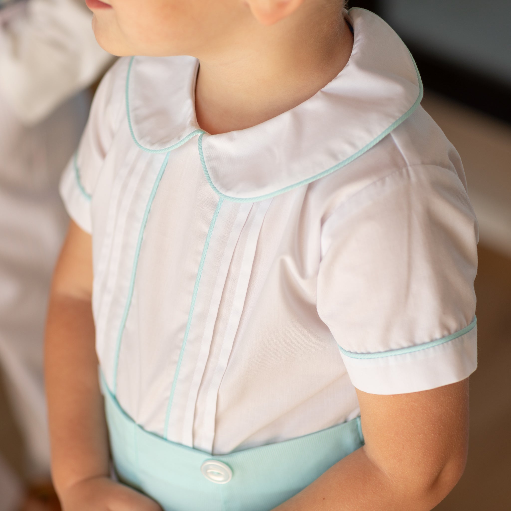Toddler boy wearing the Henry Duvall Benjamin Button-On, a traditional heirloom-style outfit designed for special occasions and family photos.