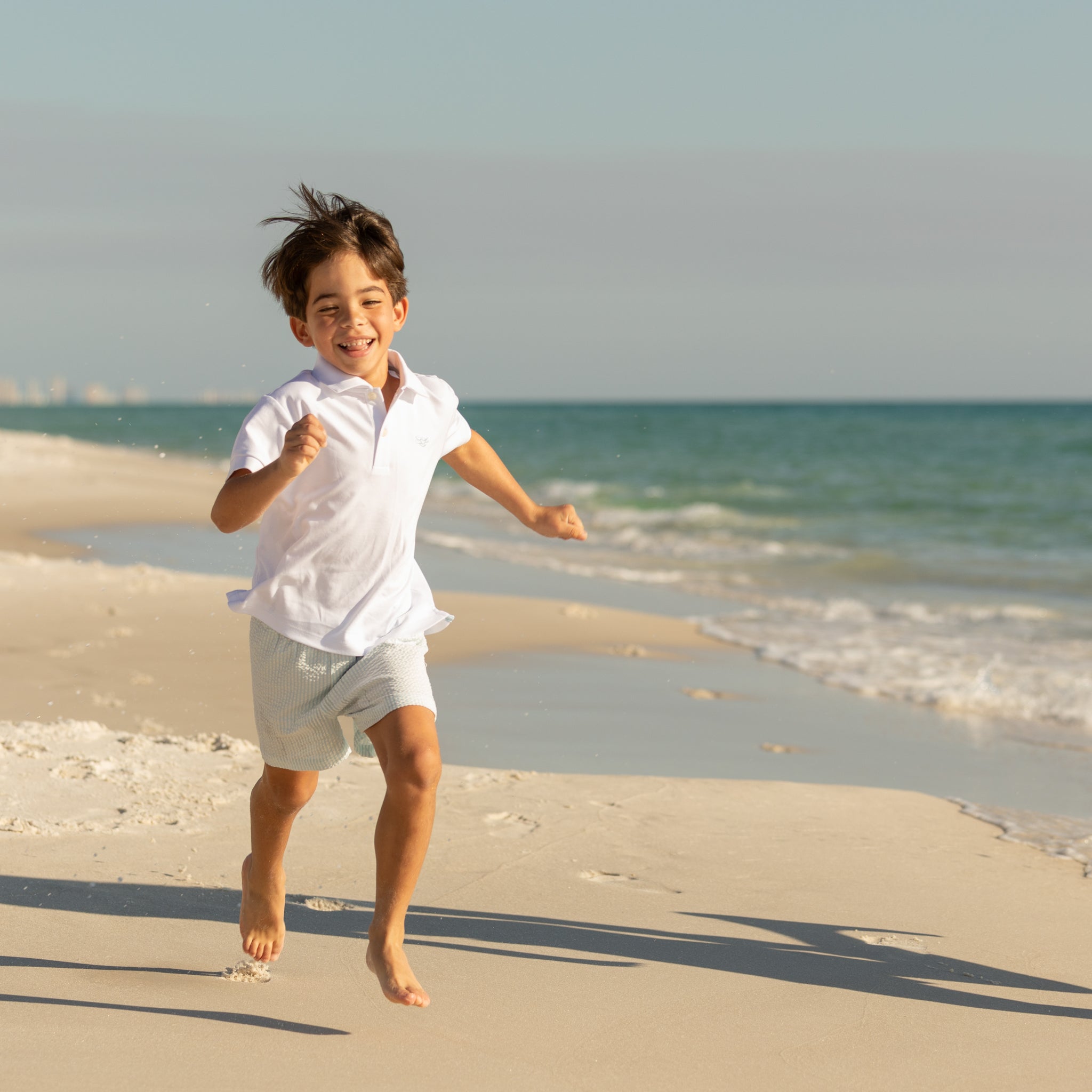 Henry Duvall boys white polo shirt with light blue embroidered logo, a classic preppy polo designed for everyday wear.