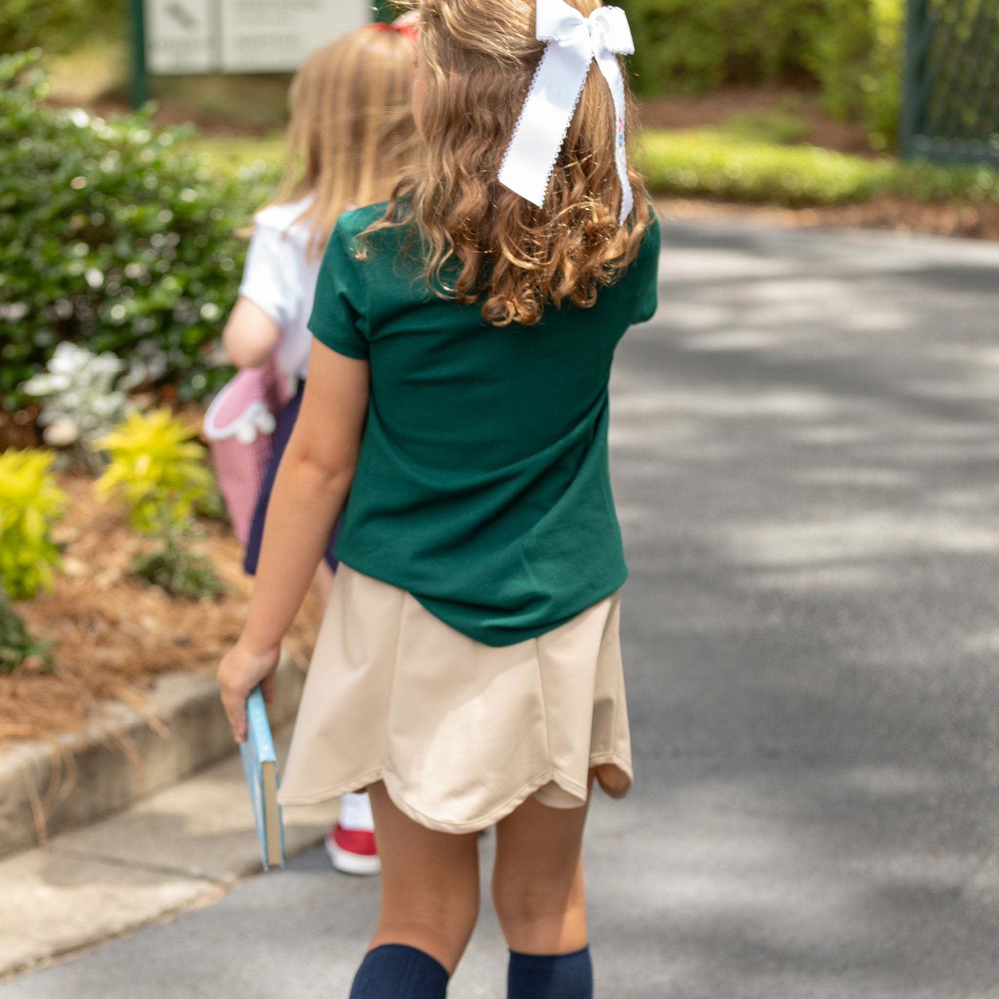 Henry Duvall Scalloped Skort in khaki or navy, performance fabric school skort with scalloped hem, built-in shorts, and hidden pocket—designed by girls for girls
