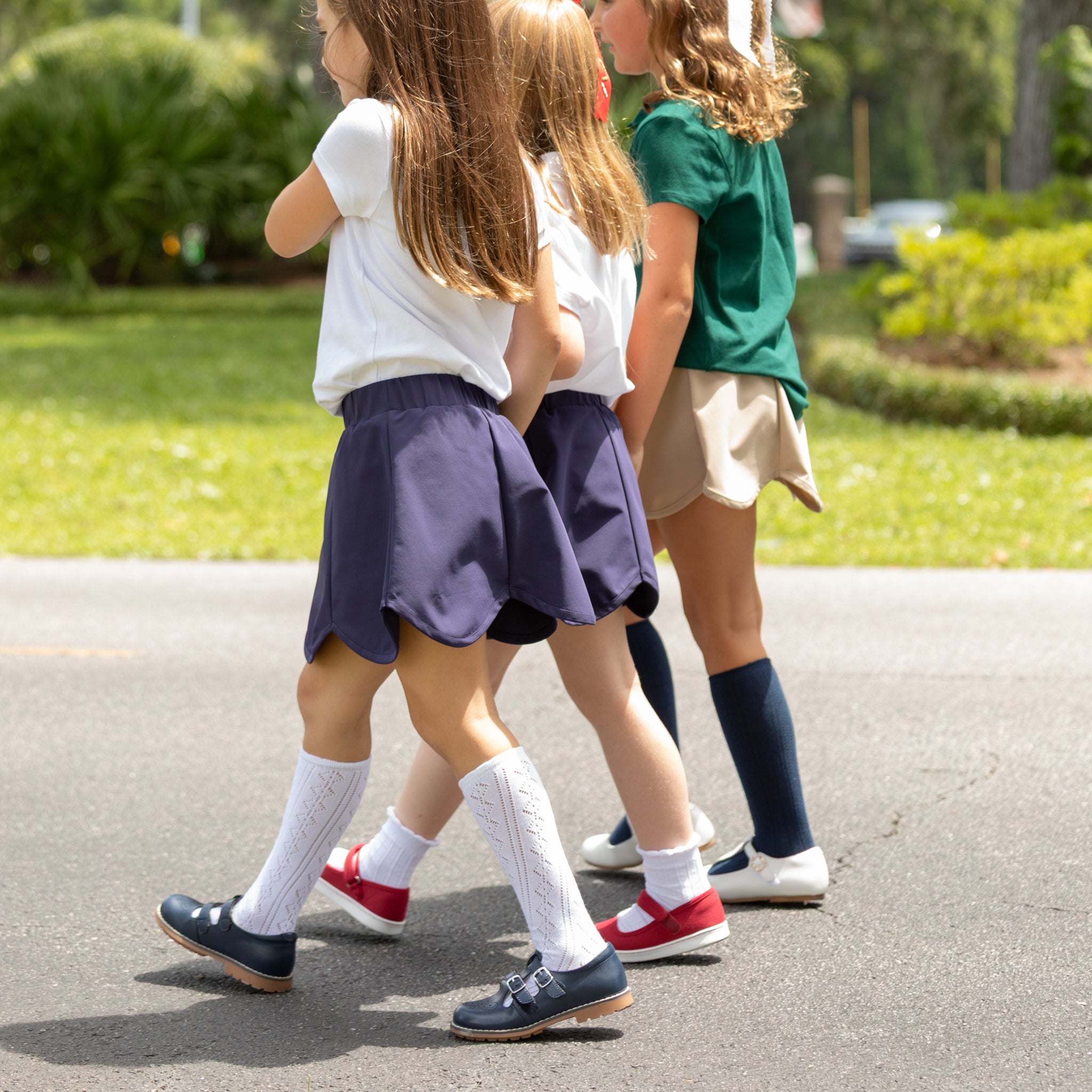 Henry Duvall Scalloped Skort in khaki or navy, performance fabric school skort with scalloped hem, built-in shorts, and hidden pocket—designed by girls for girls