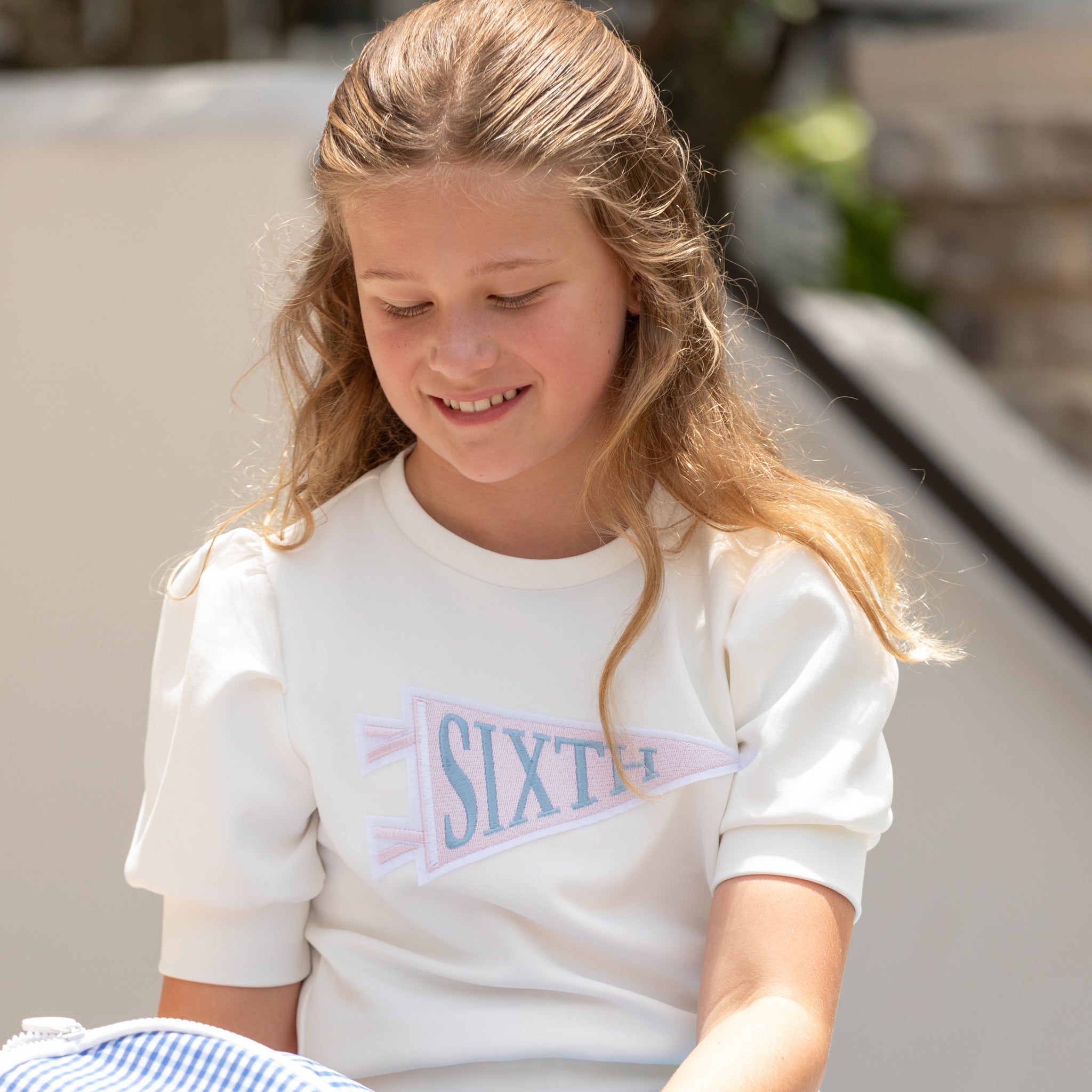 Henry Duvall Pennant Tee featuring appliqué grade pennant, classic back-to-school shirt for kindergarten through fifth grade, perfect for first day of school photos and school milestone celebrations.