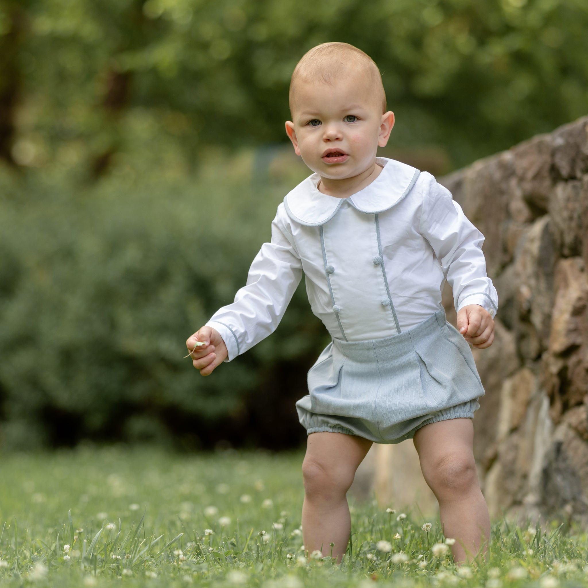 Classic baby boy bubble romper in blue gray herringbone fabric, inspired by English heritage style, heirloom-quality traditional boys clothing for portraits, holidays, and special occasions