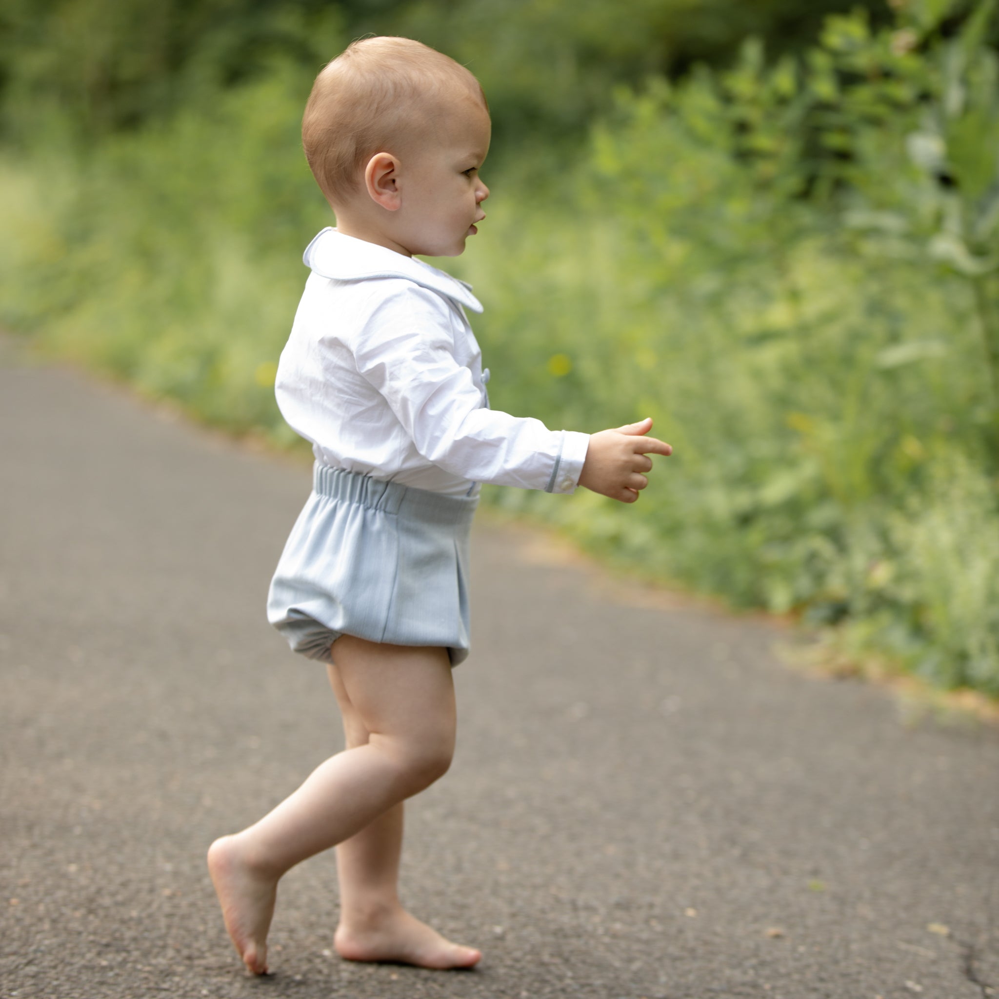Classic baby boy bubble romper in blue gray herringbone fabric, inspired by English heritage style, heirloom-quality traditional boys clothing for portraits, holidays, and special occasions