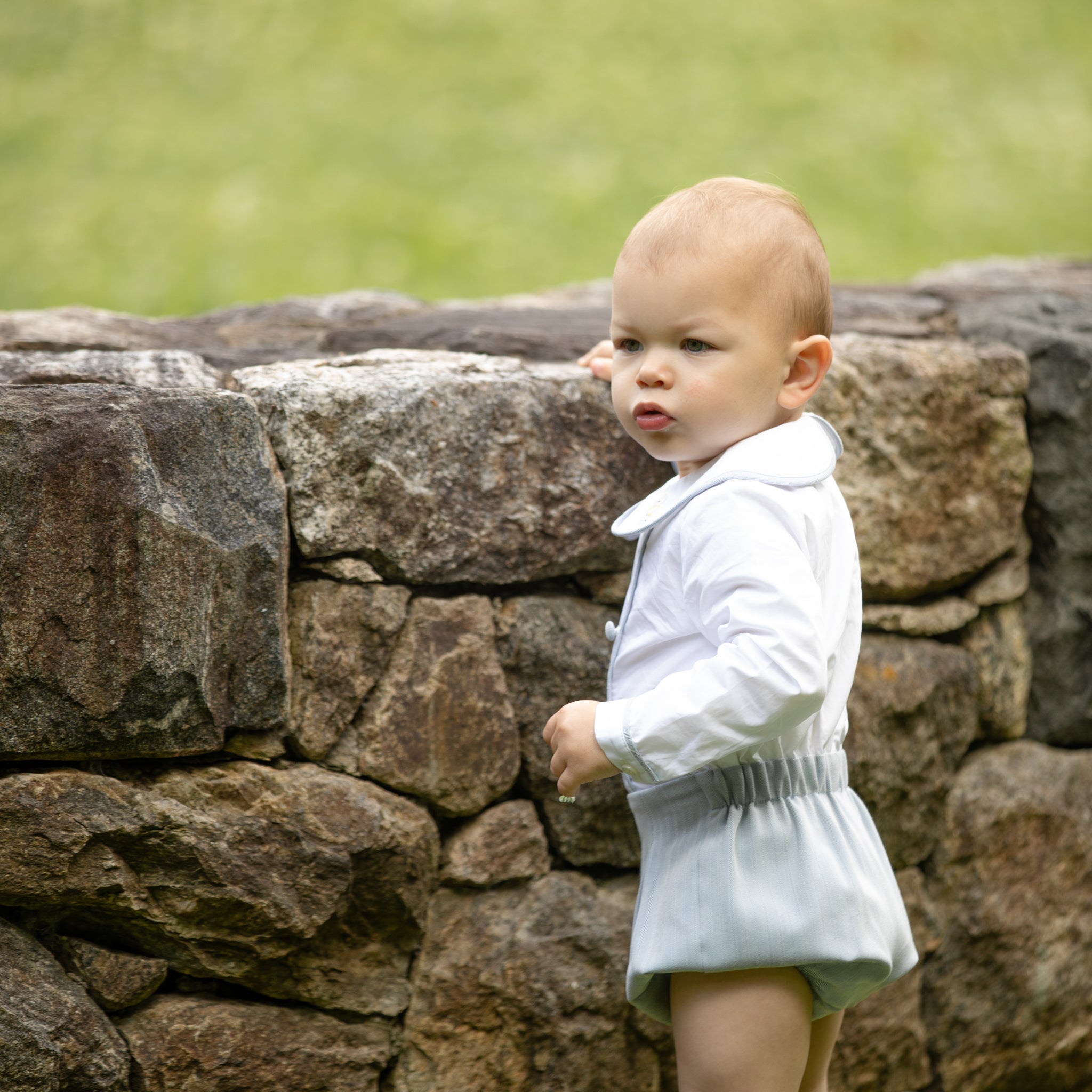 Classic baby boy bubble romper in blue gray herringbone fabric, inspired by English heritage style, heirloom-quality traditional boys clothing for portraits, holidays, and special occasions