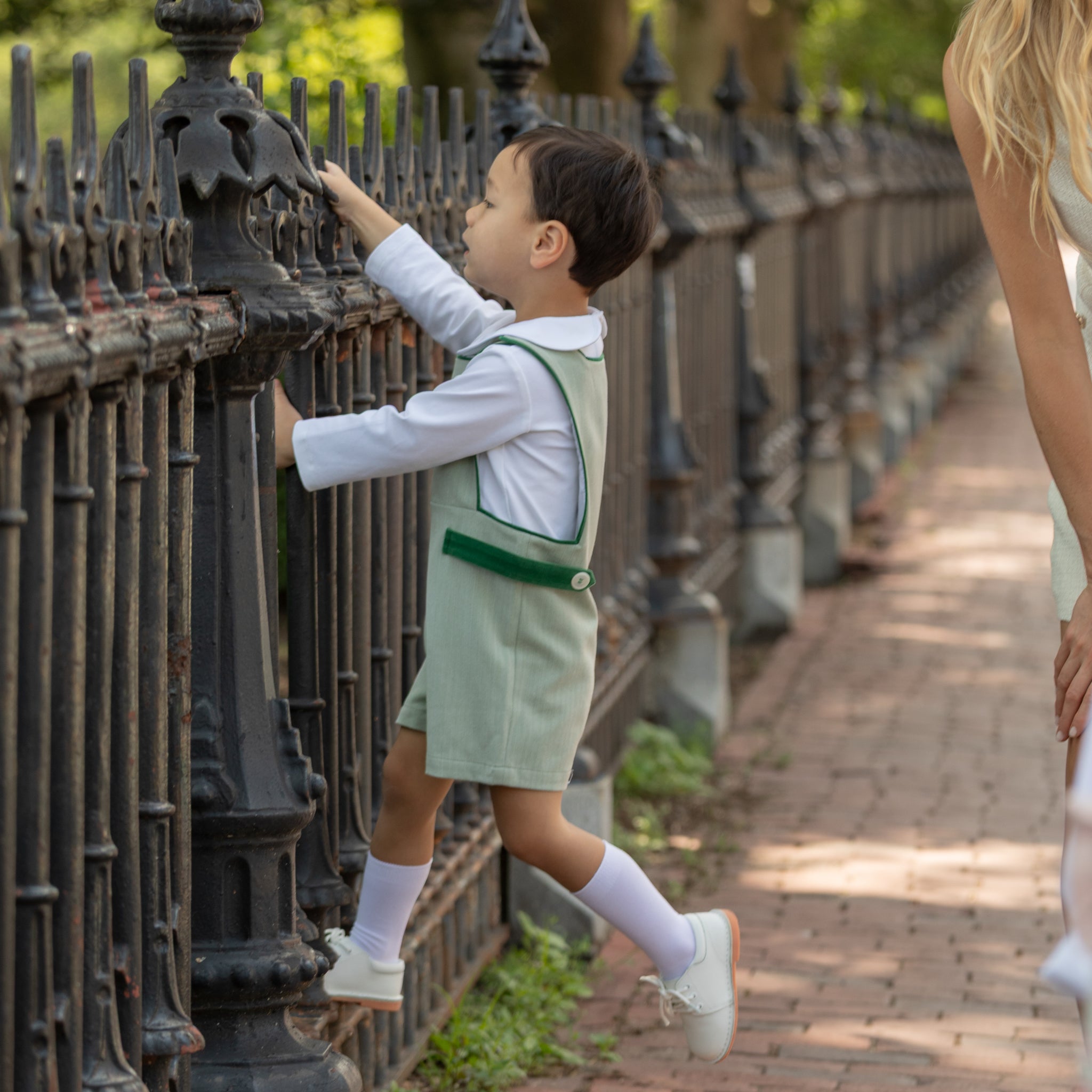 Henry Duvall classic baby boy jon jon in soft sage green herringbone, heirloom toddler outfit with shoulder buttons and stride snaps, inspired by English heritage style