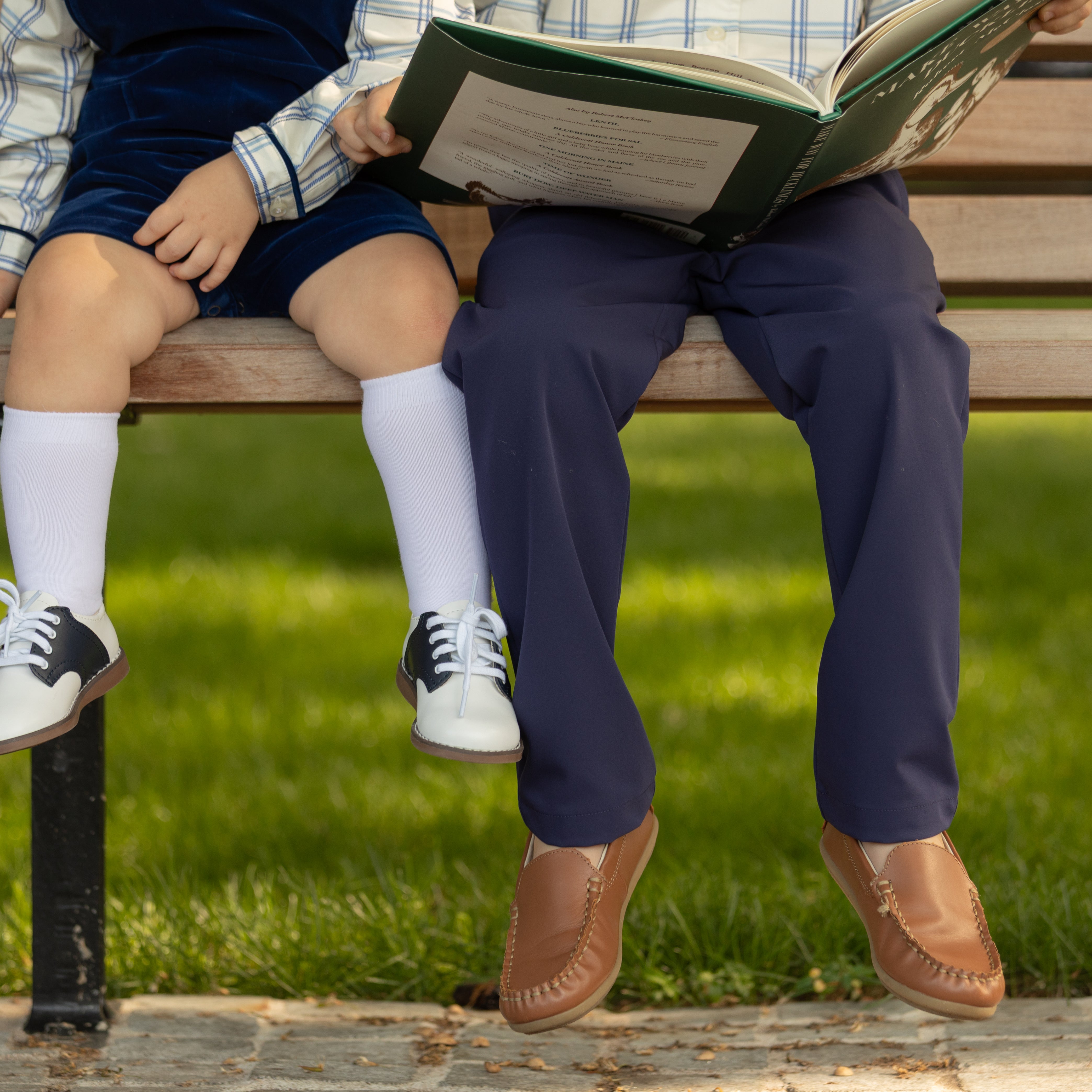 Classic white nylon knee high socks for girls and toddlers, lightweight with ribbed stay-up top, designed for comfort and perfect fit, ideal for pairing with Mary Janes or dress shoes from Henry Duvall’s Fall Collection