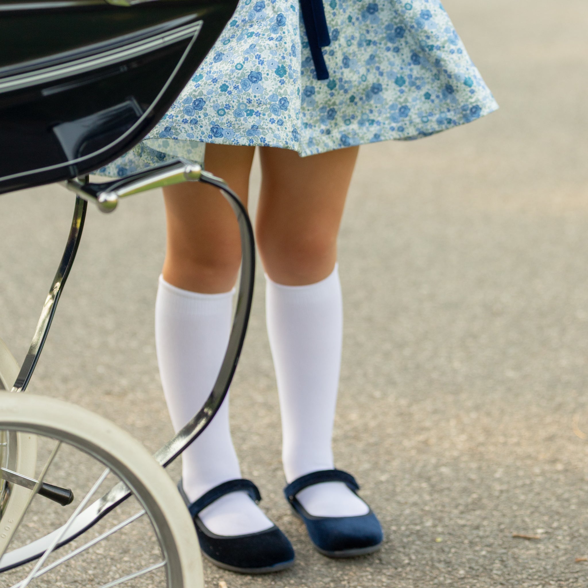 Classic white nylon knee high socks for girls and toddlers, lightweight with ribbed stay-up top, designed for comfort and perfect fit, ideal for pairing with Mary Janes or dress shoes from Henry Duvall’s Fall Collection
