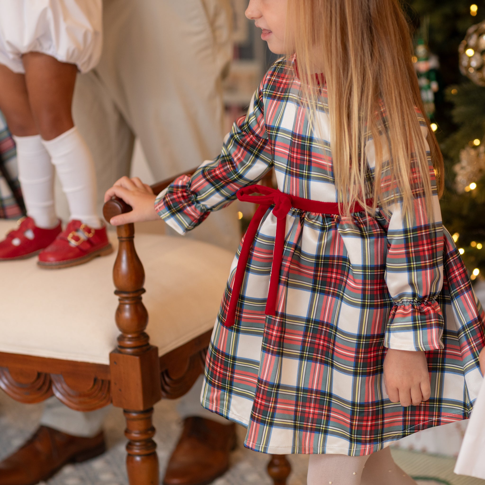 Girl's plaid holiday dress in Townsend Tartan with bow waist detail, vintage-inspired fit, perfect for family photos and festive gatherings – Henry Duvall classic