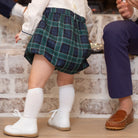 Baby boy holiday bubble in white cotton poplin and Newbury Tartan, long sleeves with snaps for easy changes, coordinates with sibling outfits for festive family photos