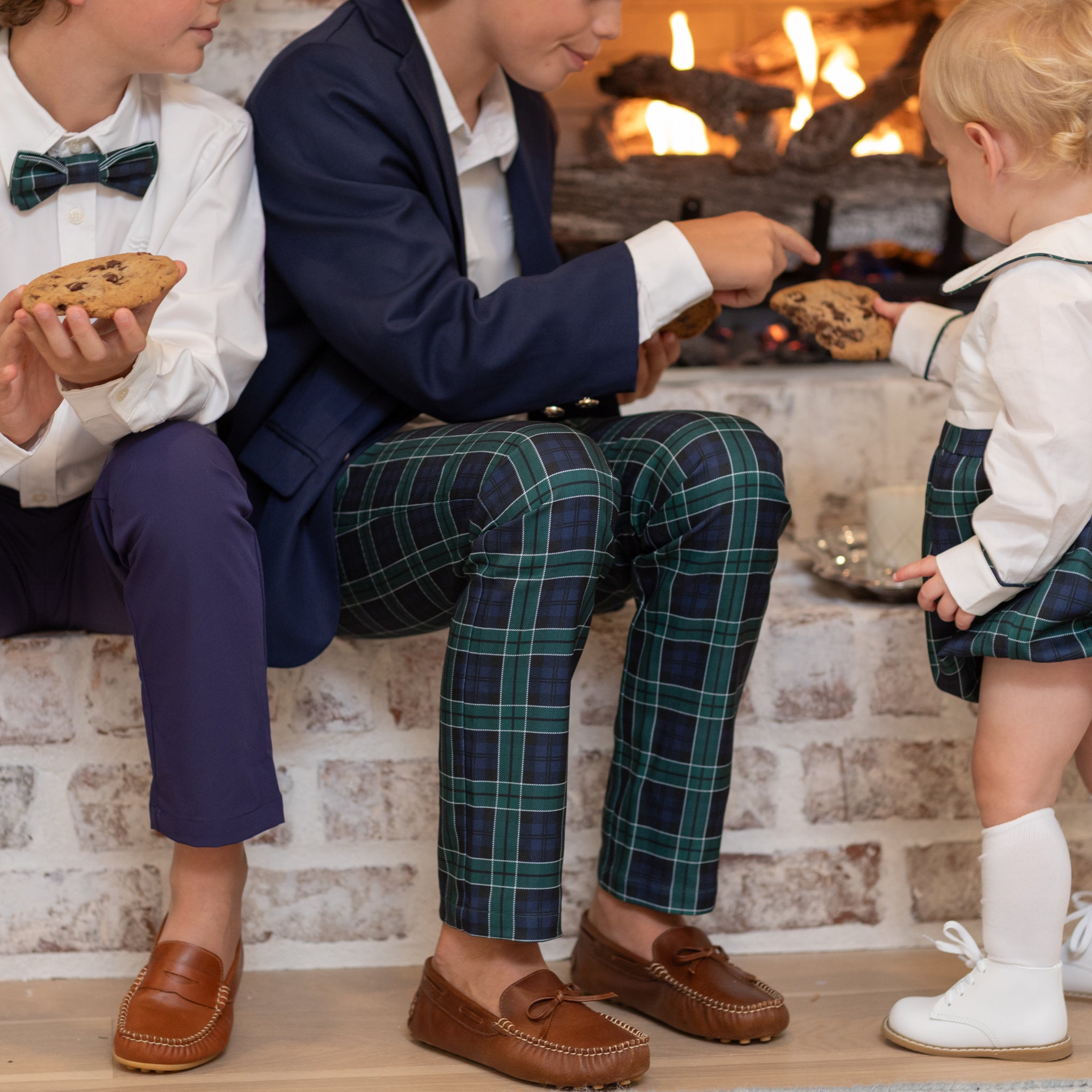 Boys holiday trousers in classic green and navy tartan, tailored Christmas pants for older boys with coordinating sibling outfits from Henry Duvall