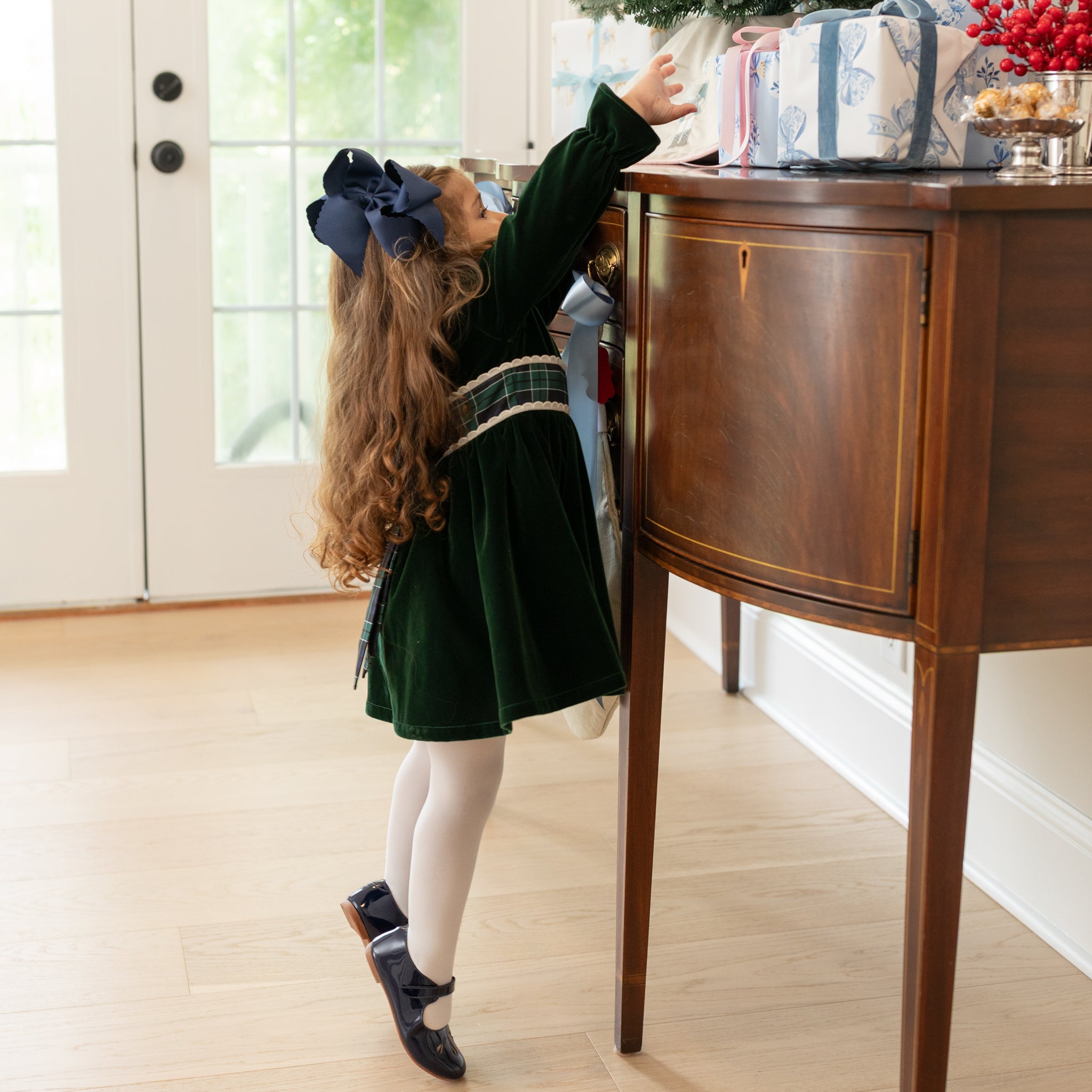 Elephantito navy patent leather Mary Jane with cut-out detail and adjustable strap, classic girls’ dress shoe for fall outfits, school events, and special occasions at Henry Duvall