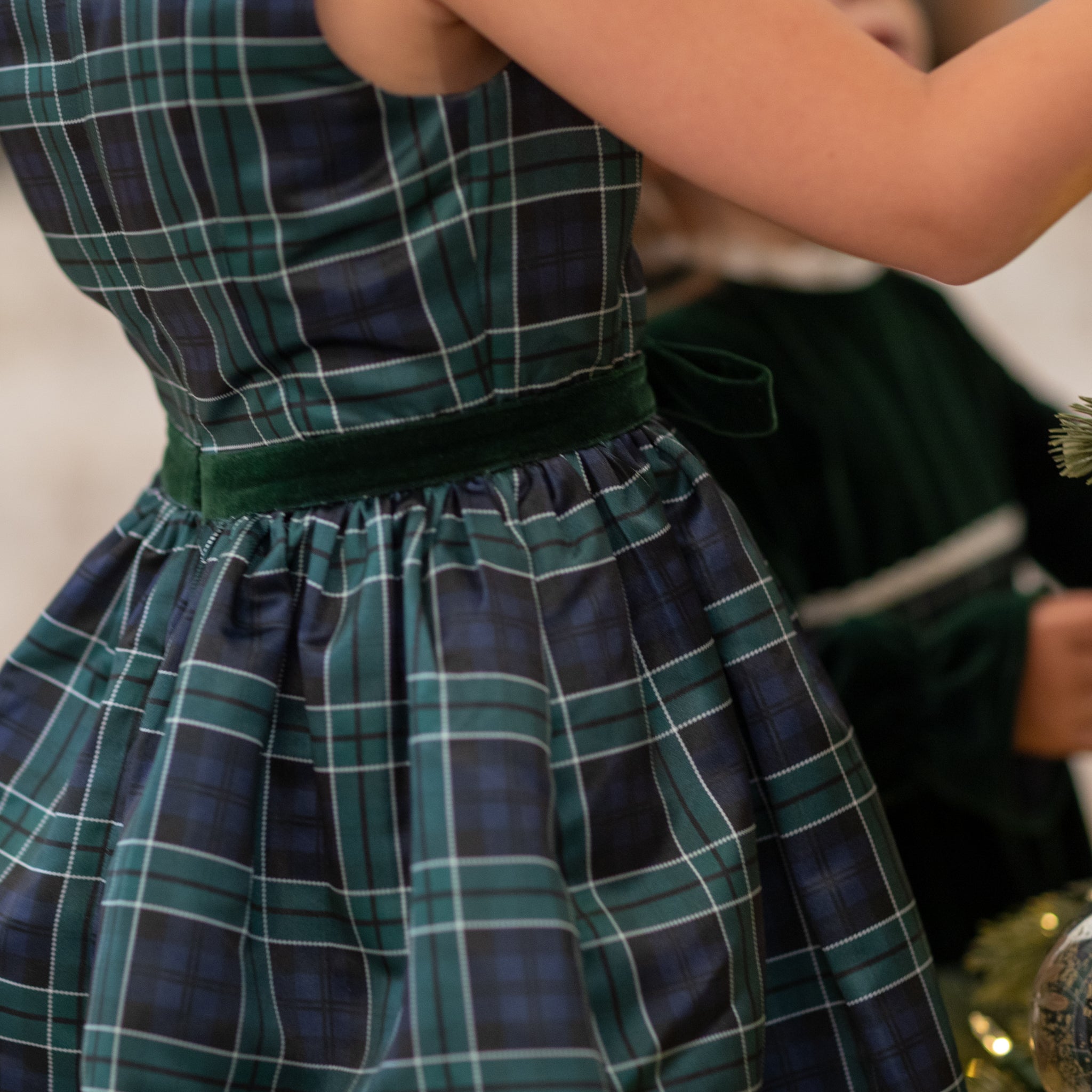 Teen girl holiday dress in Newbury Tartan with green velvet trim, classic A-line silhouette, perfect for family photos and festive gatherings