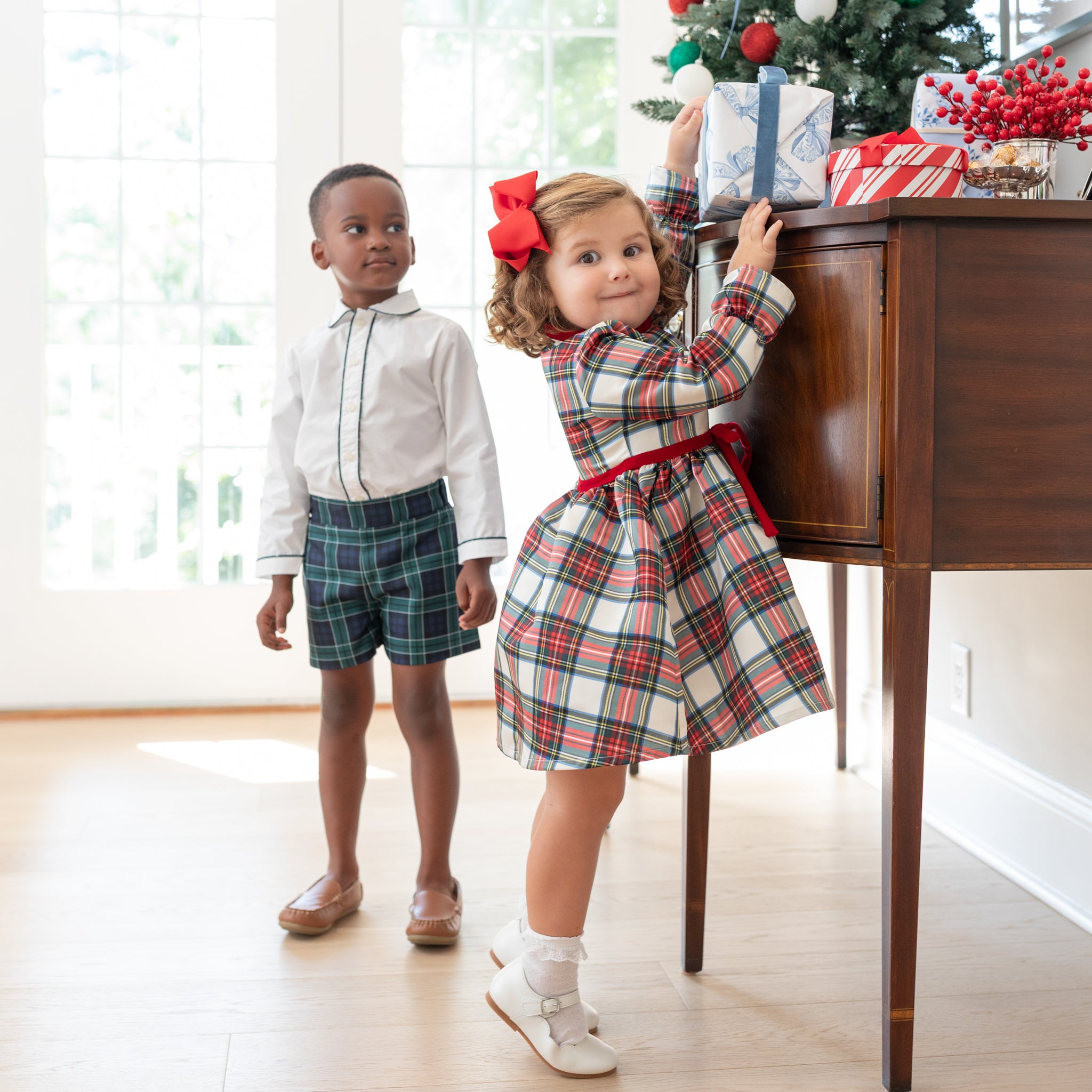 Girl's plaid holiday dress in Townsend Tartan with bow waist detail, vintage-inspired fit, perfect for family photos and festive gatherings – Henry Duvall classic