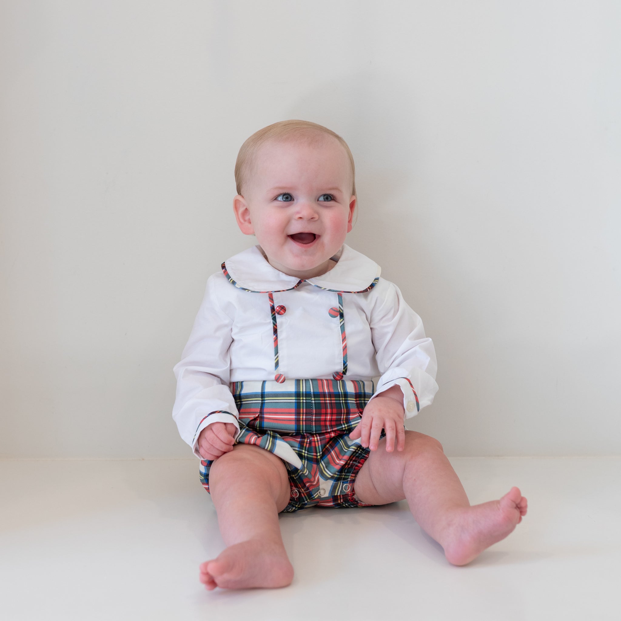 Classic baby boy bubble in traditional red Townsend Tartan with long white sleeves, boy holiday outfit with plaid for family photos