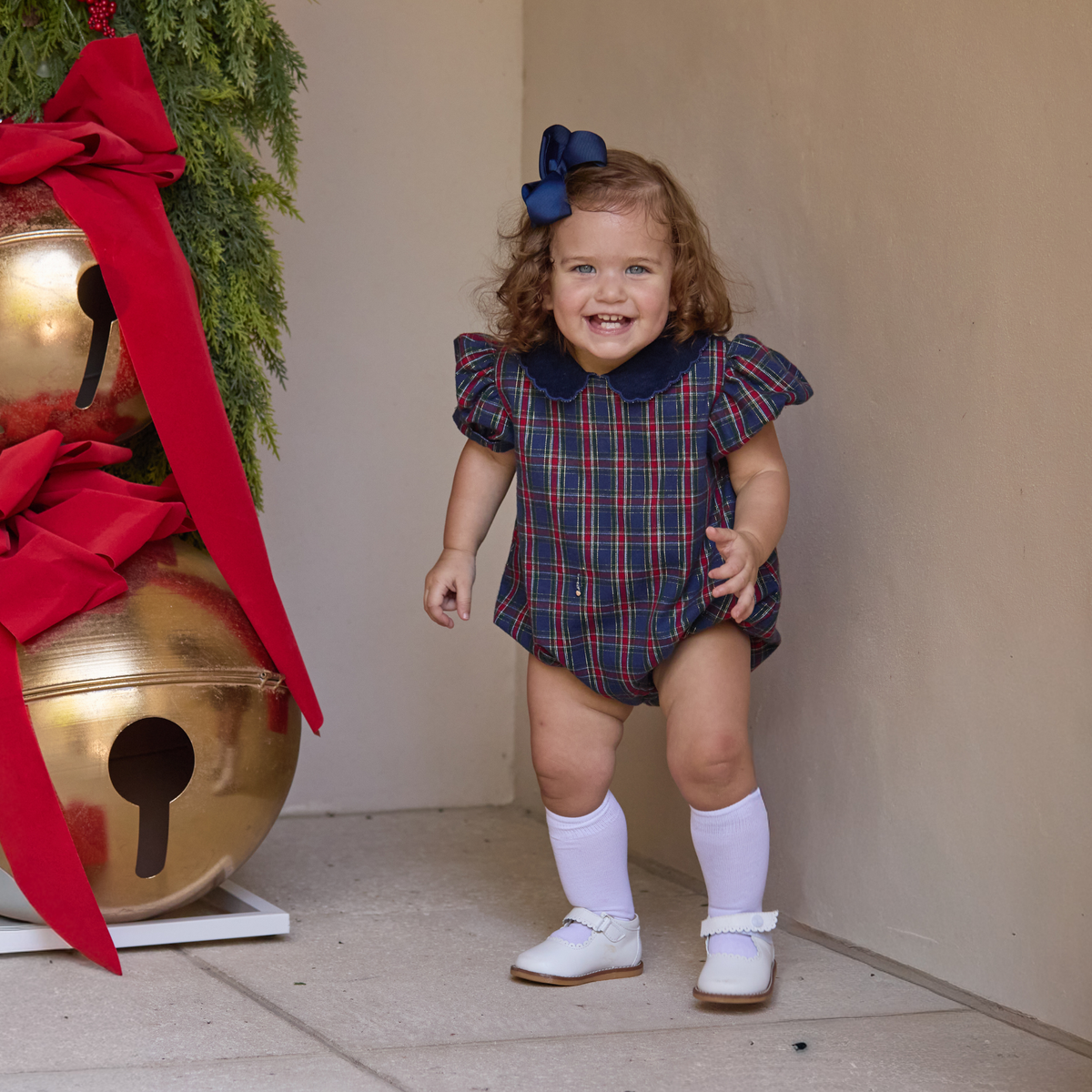 Girls’ Beatrice Bubble in navy, red, and green Tinsel Tartan with subtle metallic thread, Midnight Blue Corduroy scalloped collar, and scalloped sleeve trim.
