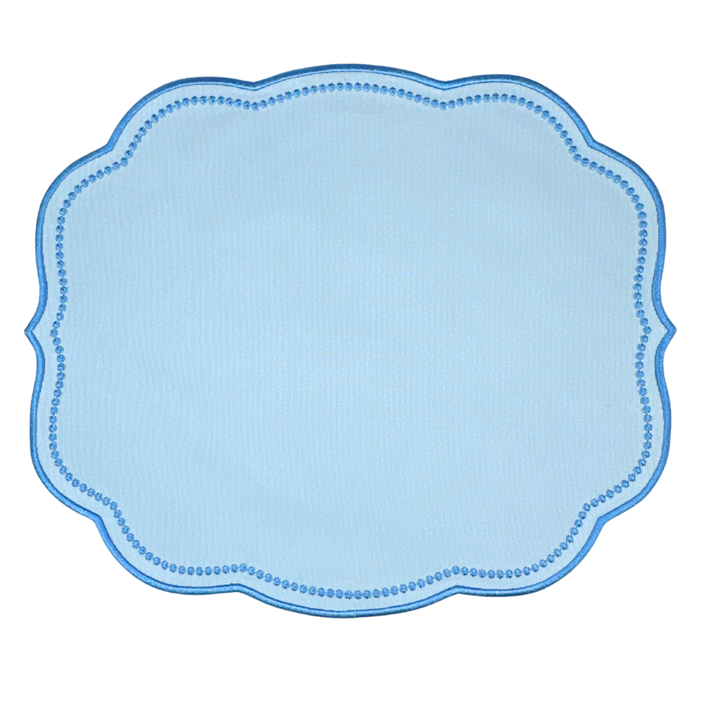 Light blue placemat with scalloped edge on a white background