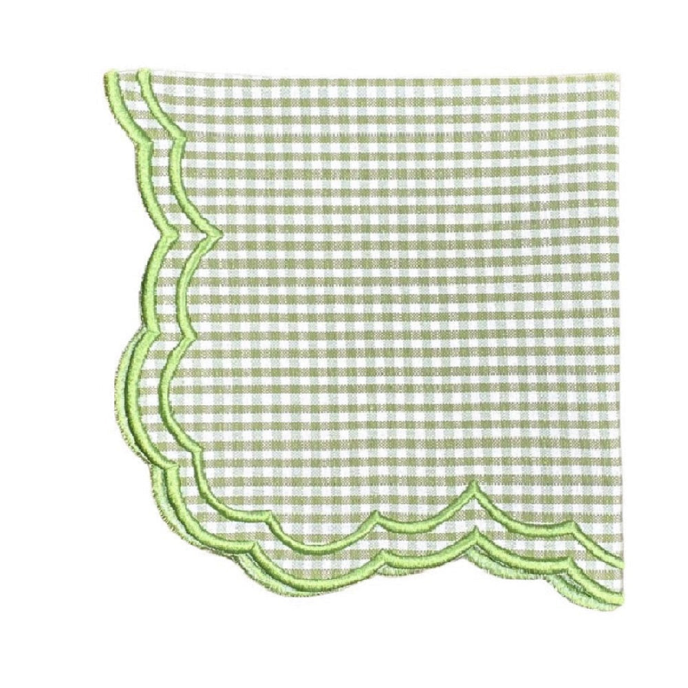 Green and white checkered napkin with scalloped edge on a white background